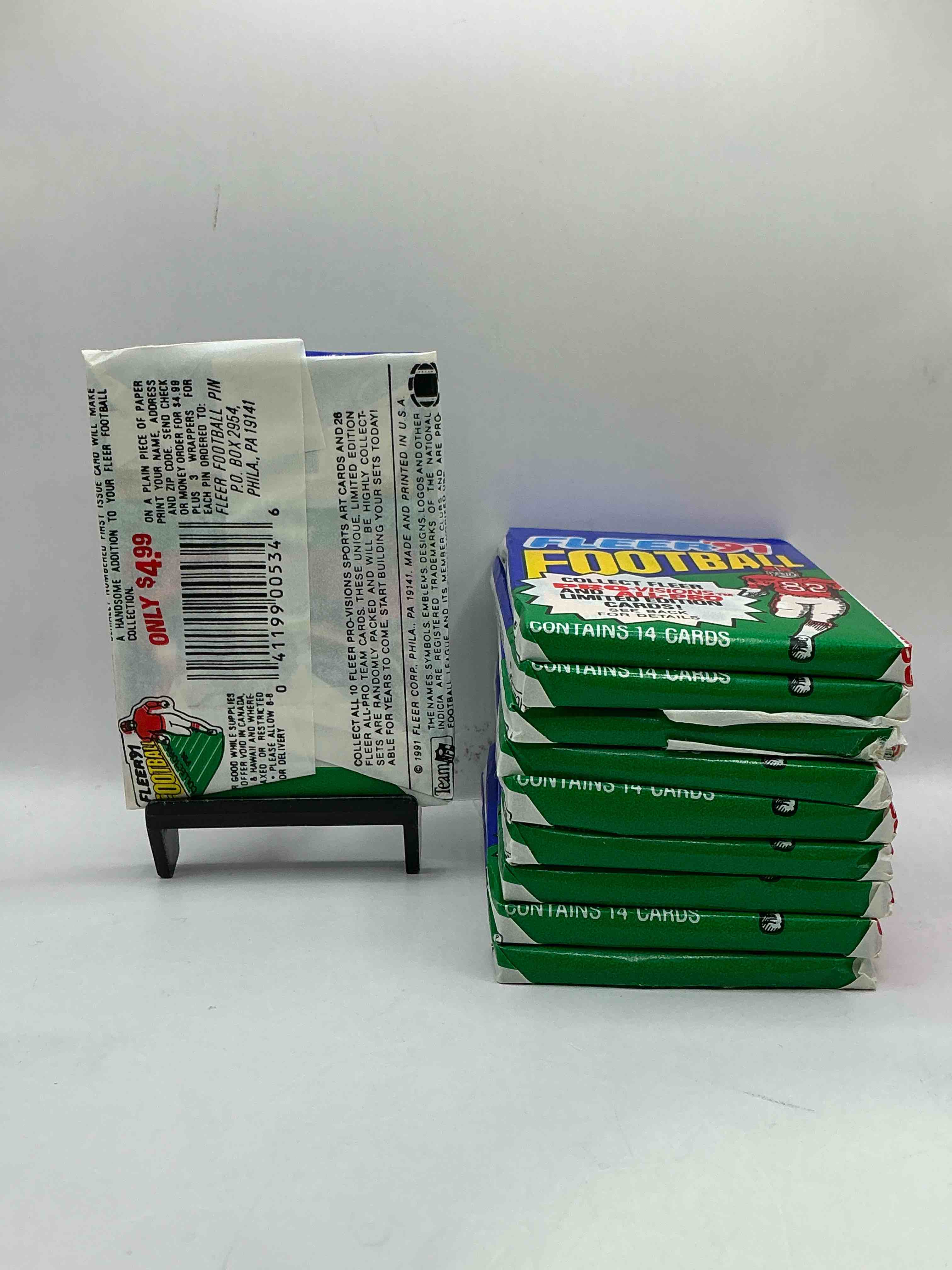 Condition photo showing New/Like New for 1991 fleer football unopened sports card wax pack, direct from original retail case. search for early barry sanders, emmitt smith, jerry rice & joe montana!