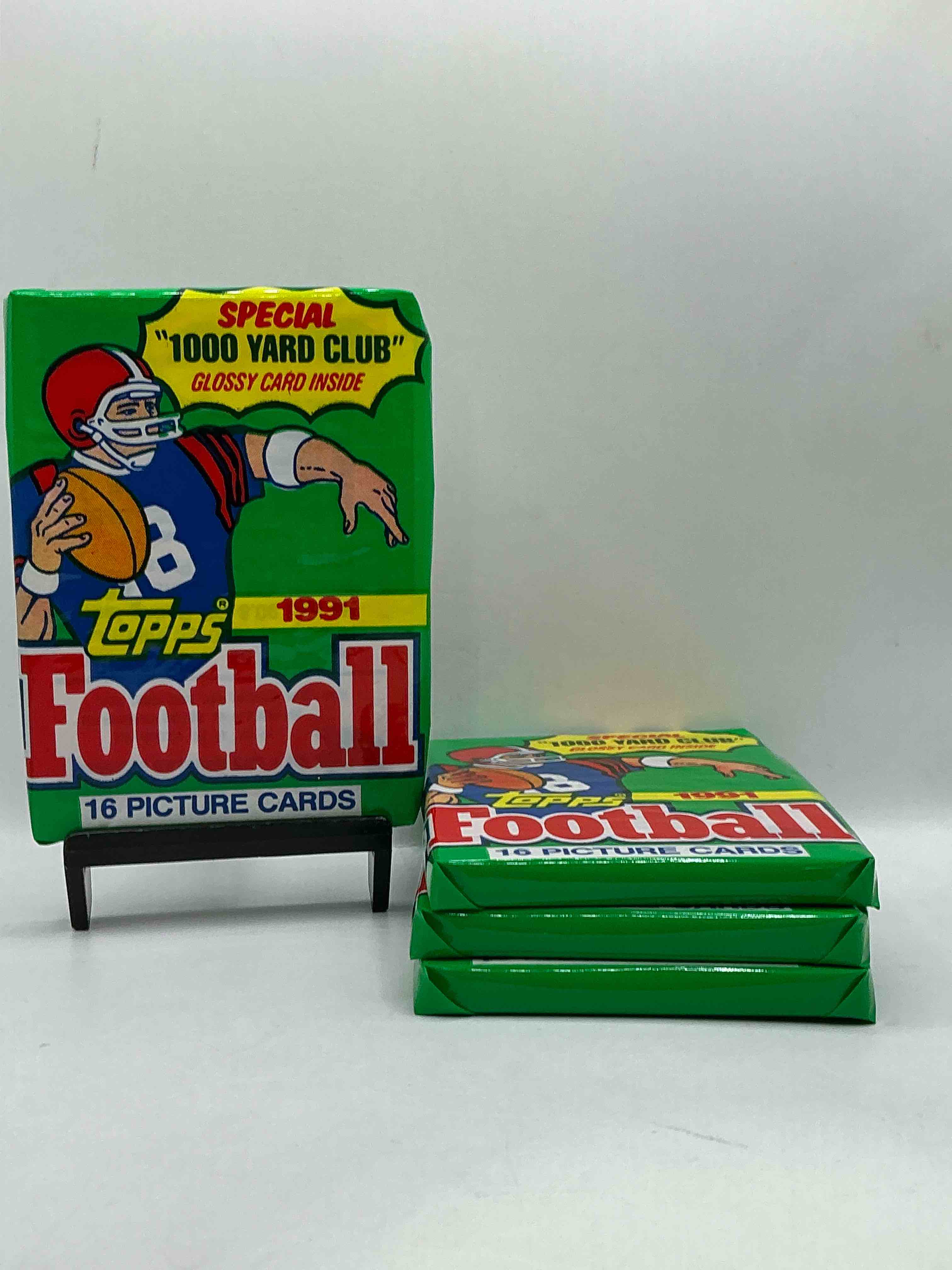 1991 topps football unopened sports card wax pack, direct from original retail case. search for early barry sanders, emmitt smith, jerry rice & joe montana!