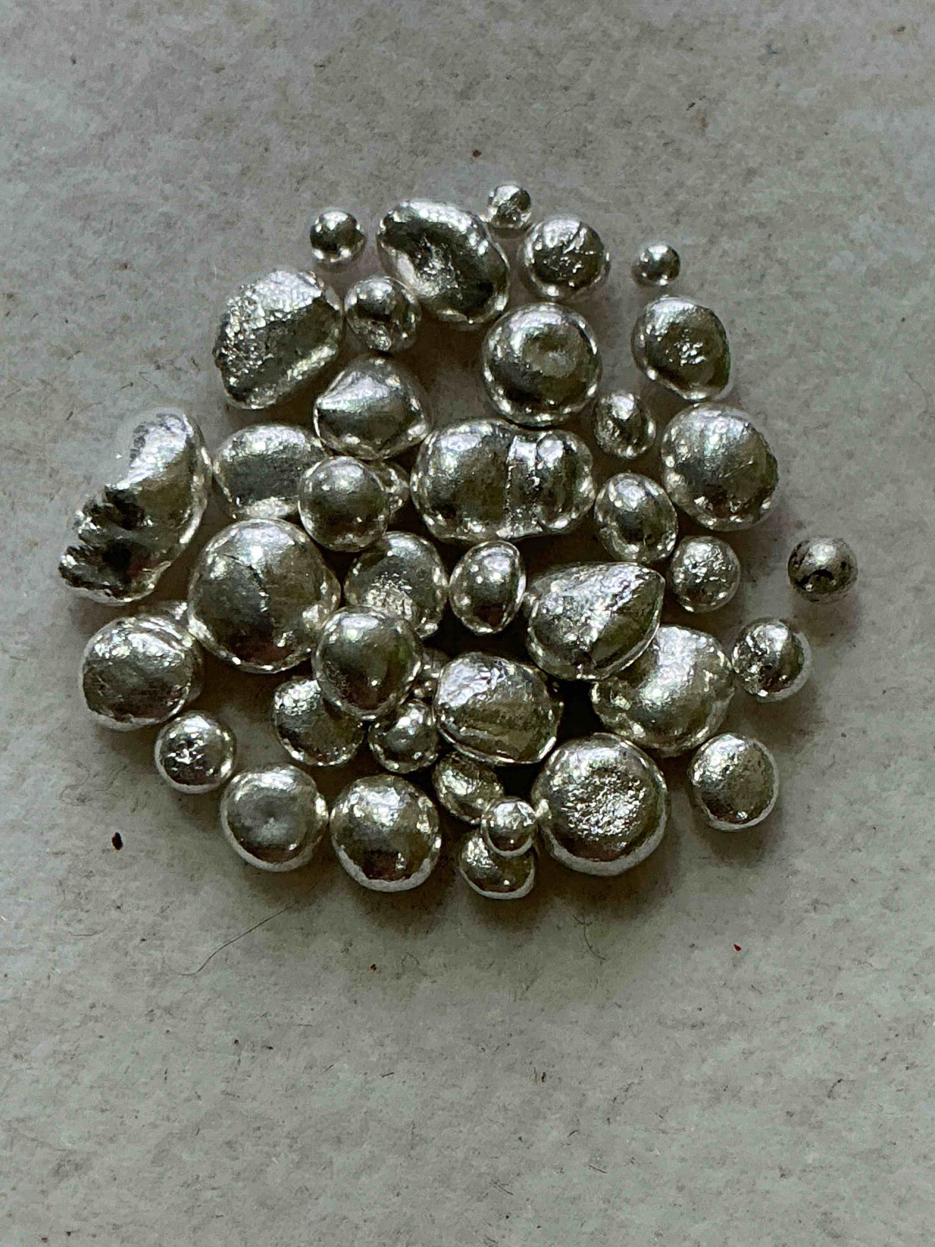 silver nuggets! .999 us fine silver, in small nugget form! total weight of all nuggets in lot approximately 6 grams, bid is per nugget! a cool way to invest in fine us silver! includes collector capsule!