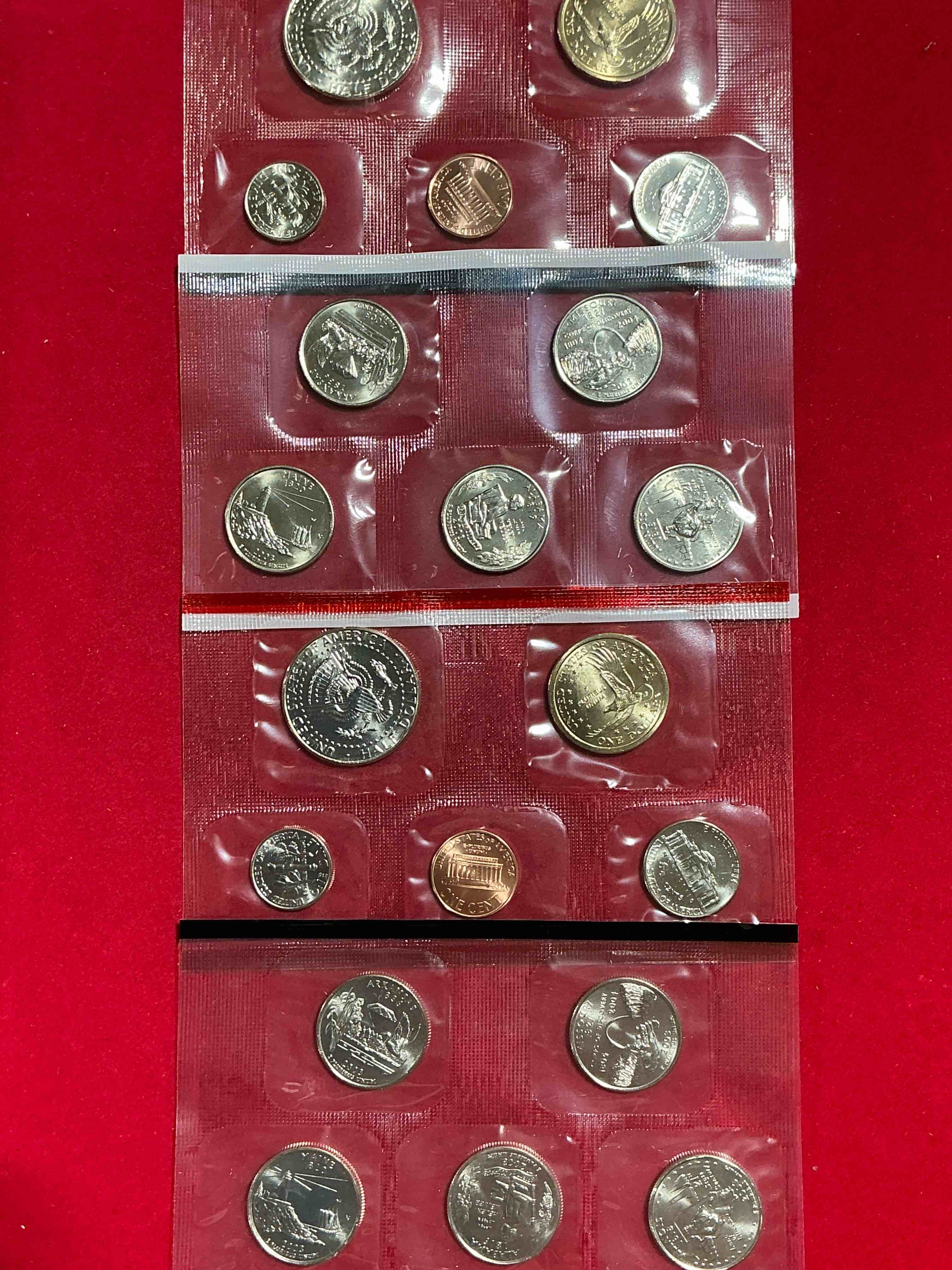 Condition photo showing New/Like New for 2003 uncirculated mint coins! 20 coins from philadelphia & denver! 20 coin uncirculated lot, with state quarters, nickels, half dollars, dimes, pennies & more! uncirculated coin craziness!