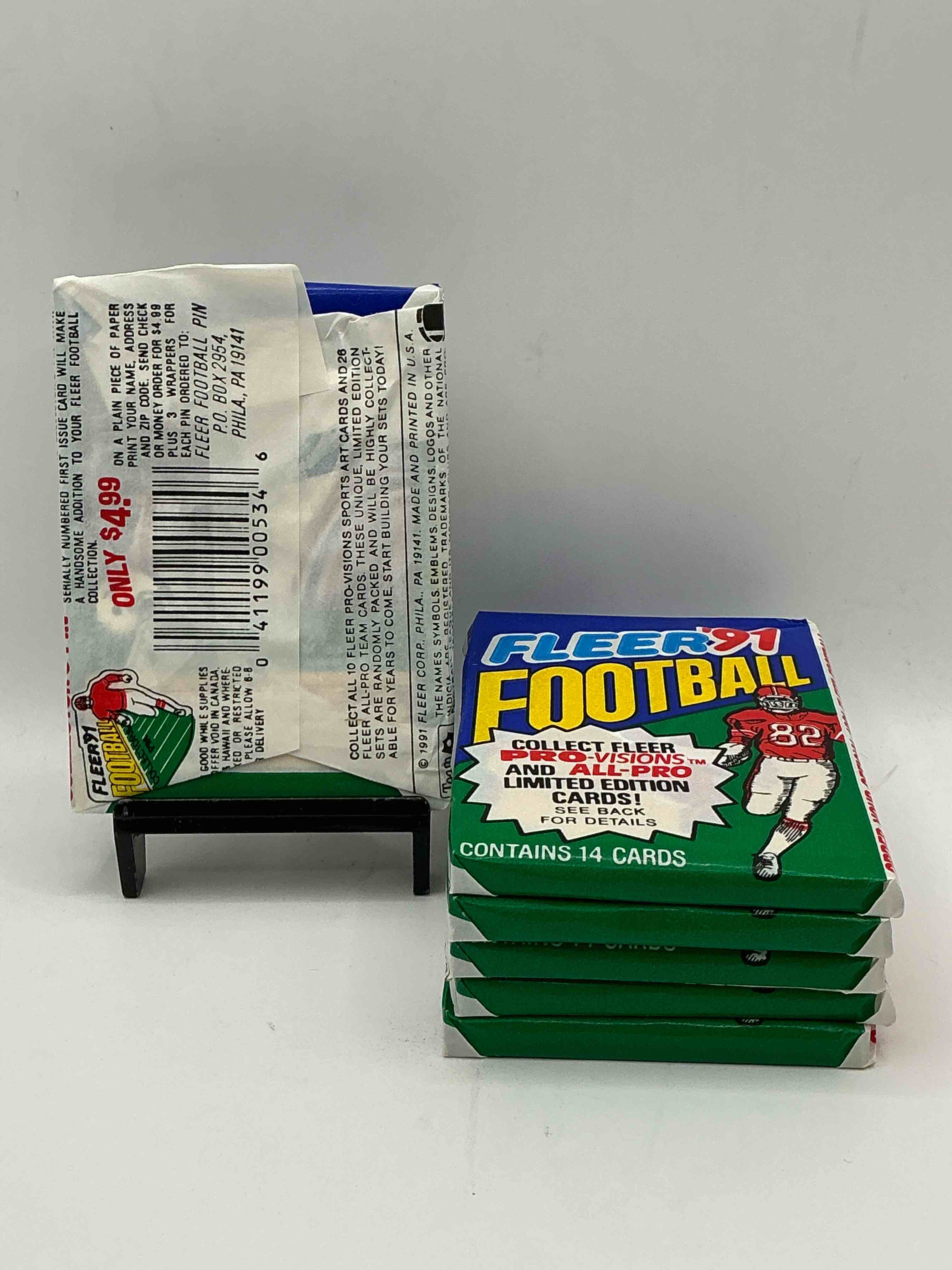 Condition photo showing New/Like New for 1991 fleer football unopened sports card wax pack, direct from original retail case. search for early barry sanders, emmitt smith, jerry rice & joe montana!