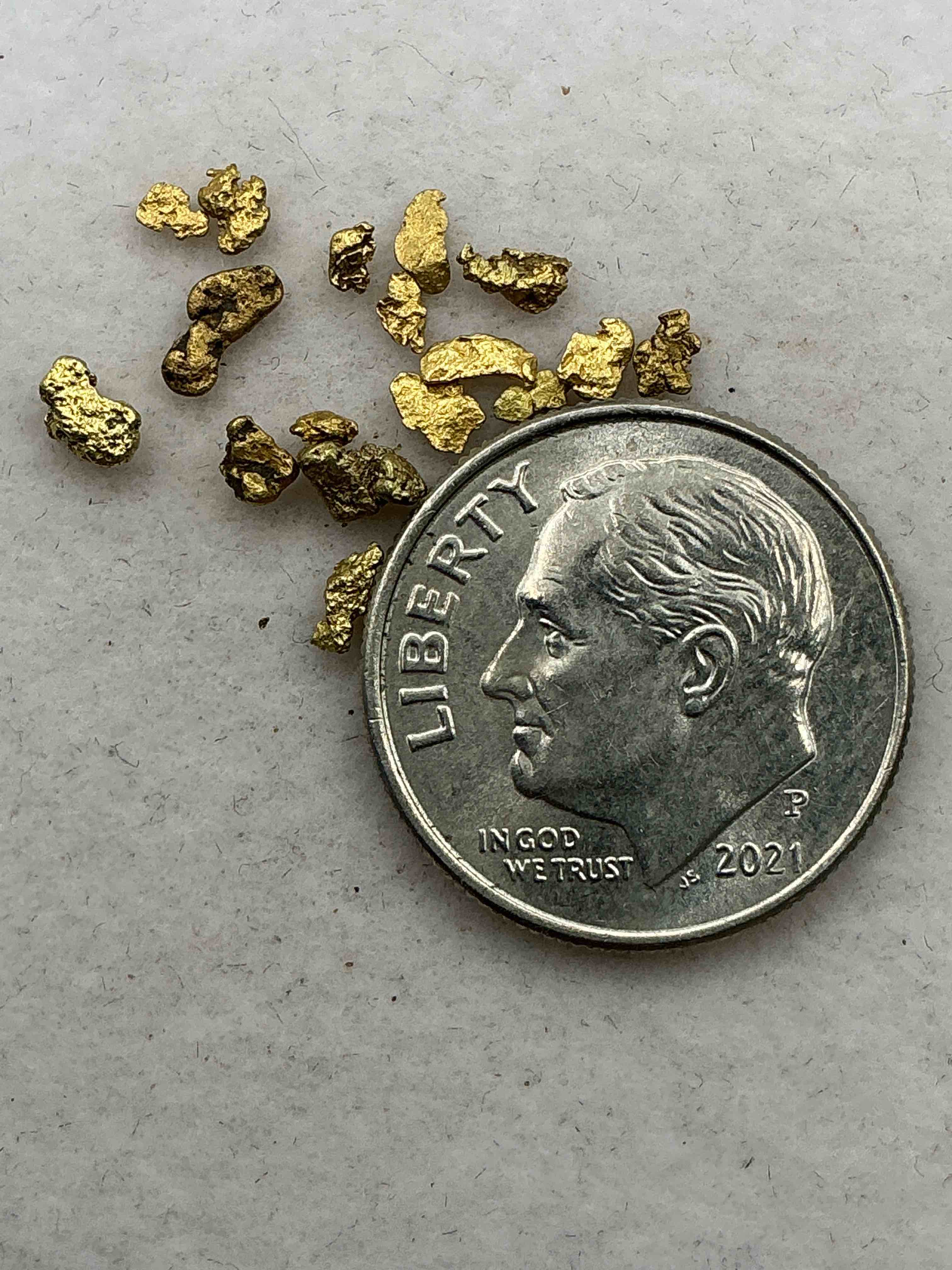 Condition photo showing Good Condition for genuine gold nuggets! gold nuggets fresh from prospecting north carolina mountains, total weight of all nuggets is approximately .5 grams. these gold nuggets typically test at between approx 22-24 karat. gold in raw, prospected form is extremely hard to find & much rarer than any refined form. get in on the gold craze... gold has increased in value over 40% since 2025! u.s. dime for size reference only (not included). gold vile in image included. own genuine, gold nuggets! 