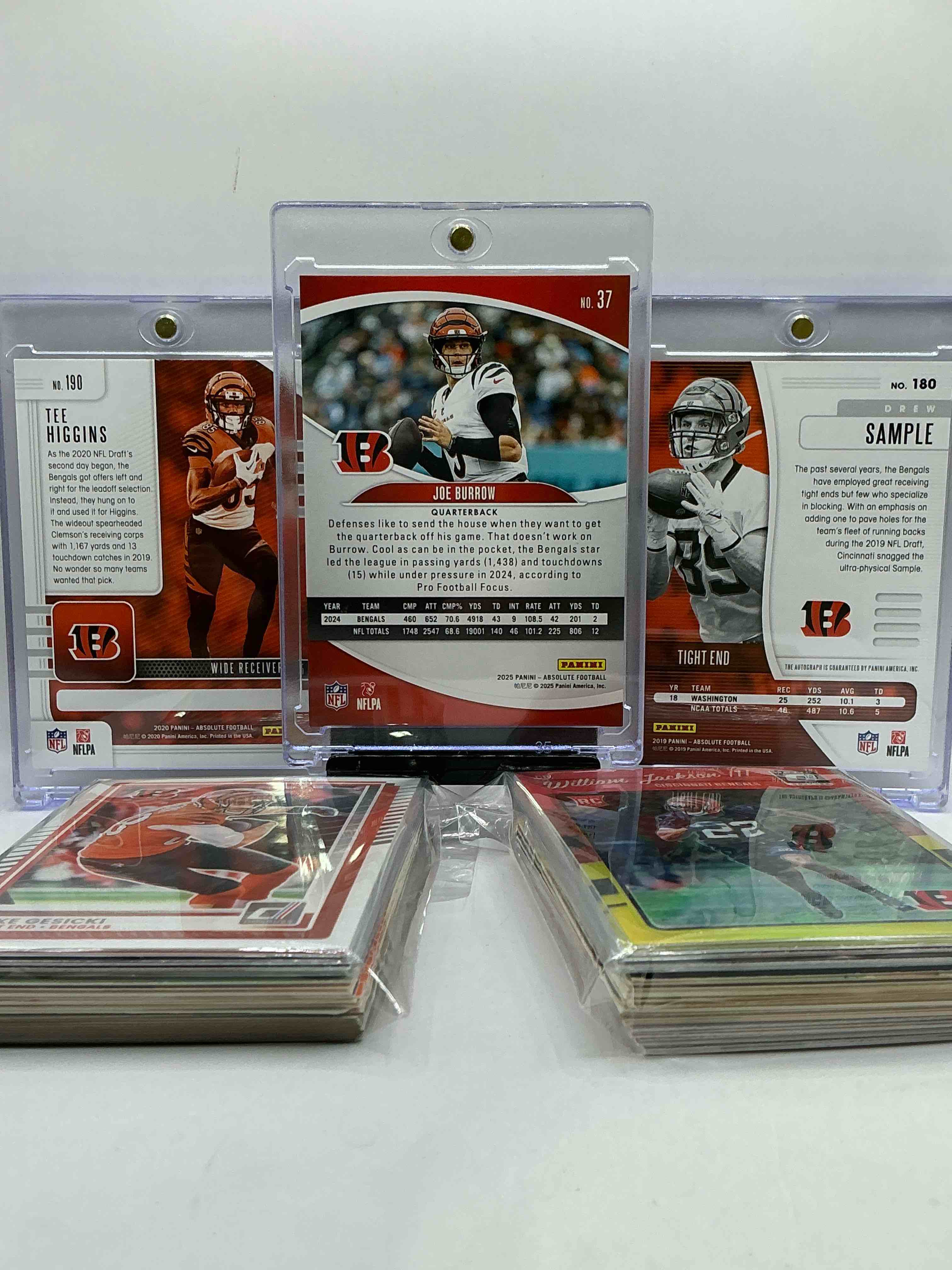 Condition photo showing New/Like New for bengals bonanza! joe burrow /325 absolute card, drew sample rookie auto /10 card & tee higgins rookie! bengals craziness! this 50 card lot includes commons, legends & more, vintage & new!