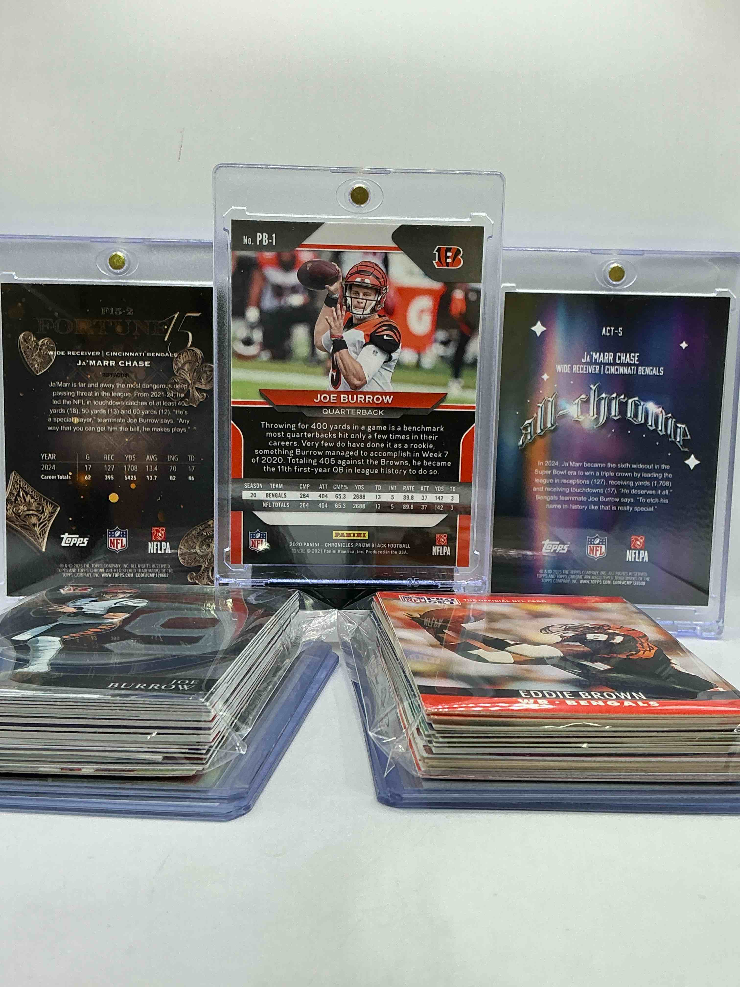 Condition photo showing New/Like New for joe burrow prizm black rookie card, topps chrome fortune 15 ja’marr chase, cincy all chrome ja’marr chase & more! this 50 card lot includes commons, legends, heroes, vintage & new & more! bengals!
