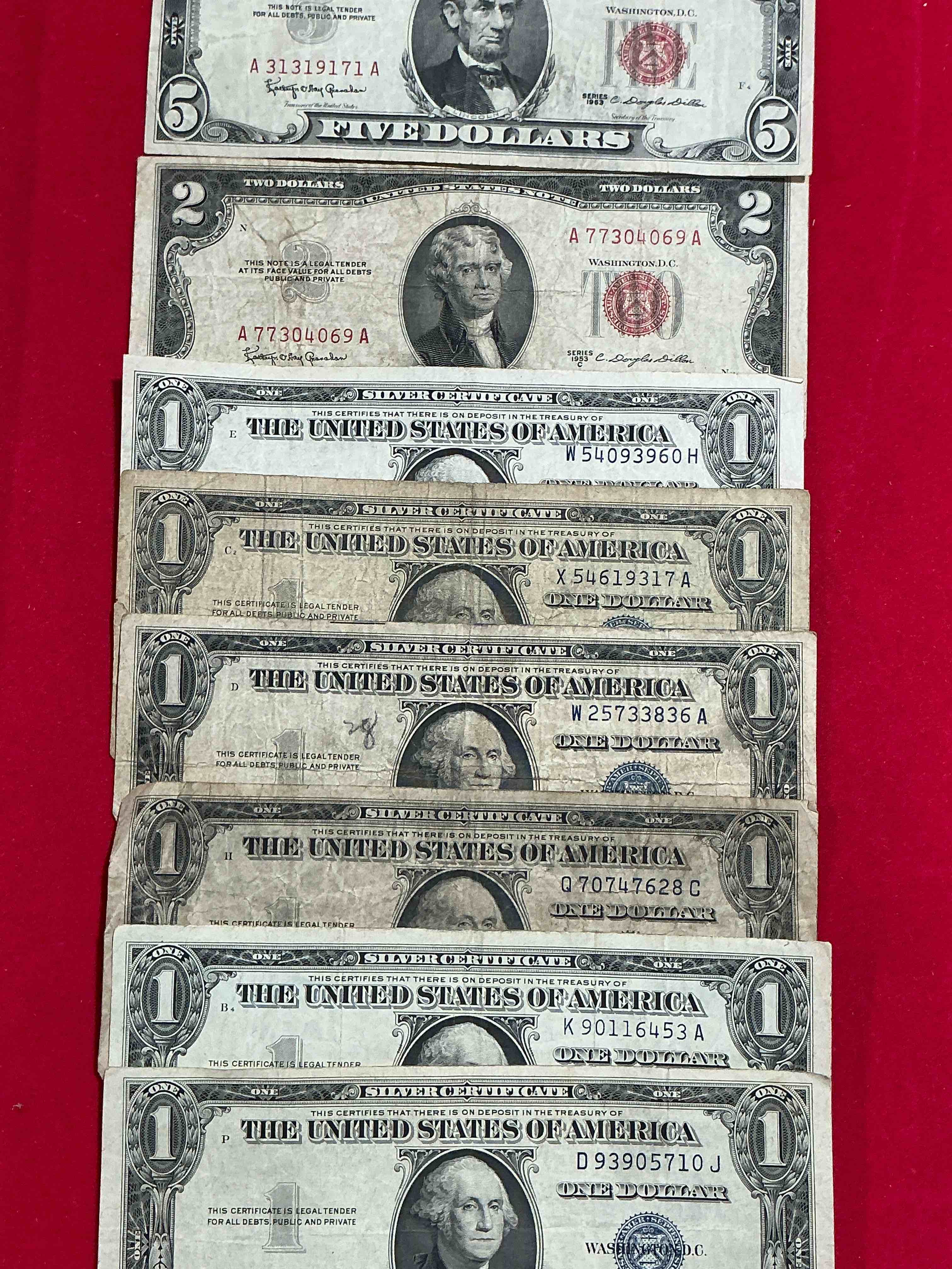 Rare American Dollar Bills! Red Seal Five Dollar Bill & Red Seal Two Dollar Bill, Along With Silver Certificates! Five Dollar Bill Ultra Rare & In Good Condition, Red Seal Two Dollar Bill In Good Condition & Silver Certificates Produced From 1878 To 1964 & Are Still Considered Legal Tender At Face Value. Here Are Gorgeous, Circulated 1935 & 1957 U.S. One Dollar Silver Certificate, With Highly Collectible "Blue Seal!* Own An Awesome Piece Of History! American Dollar Lot! 