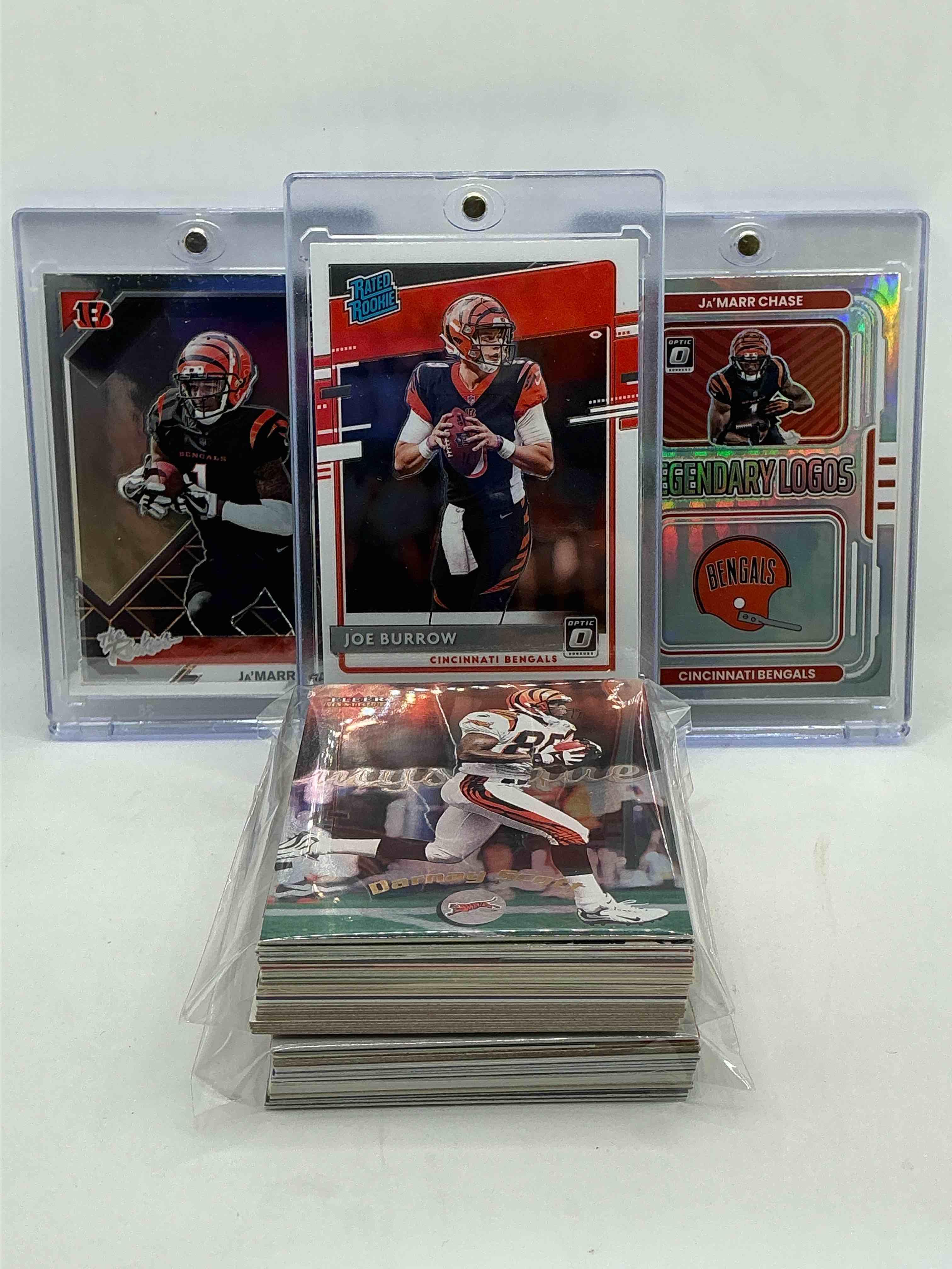 Bengals Bonanza! 2020 Donruss Optic Rated Rookie Joe Burrow! 2021 Donruss Optic “The Rookies” Ja’marr Chase! 2022 Donruss Optic Silver Prizm “Legendary Logos” Ja’marr Chase! Along With 50 Other Bengals Heroes, Legends, Rookies & Commons!