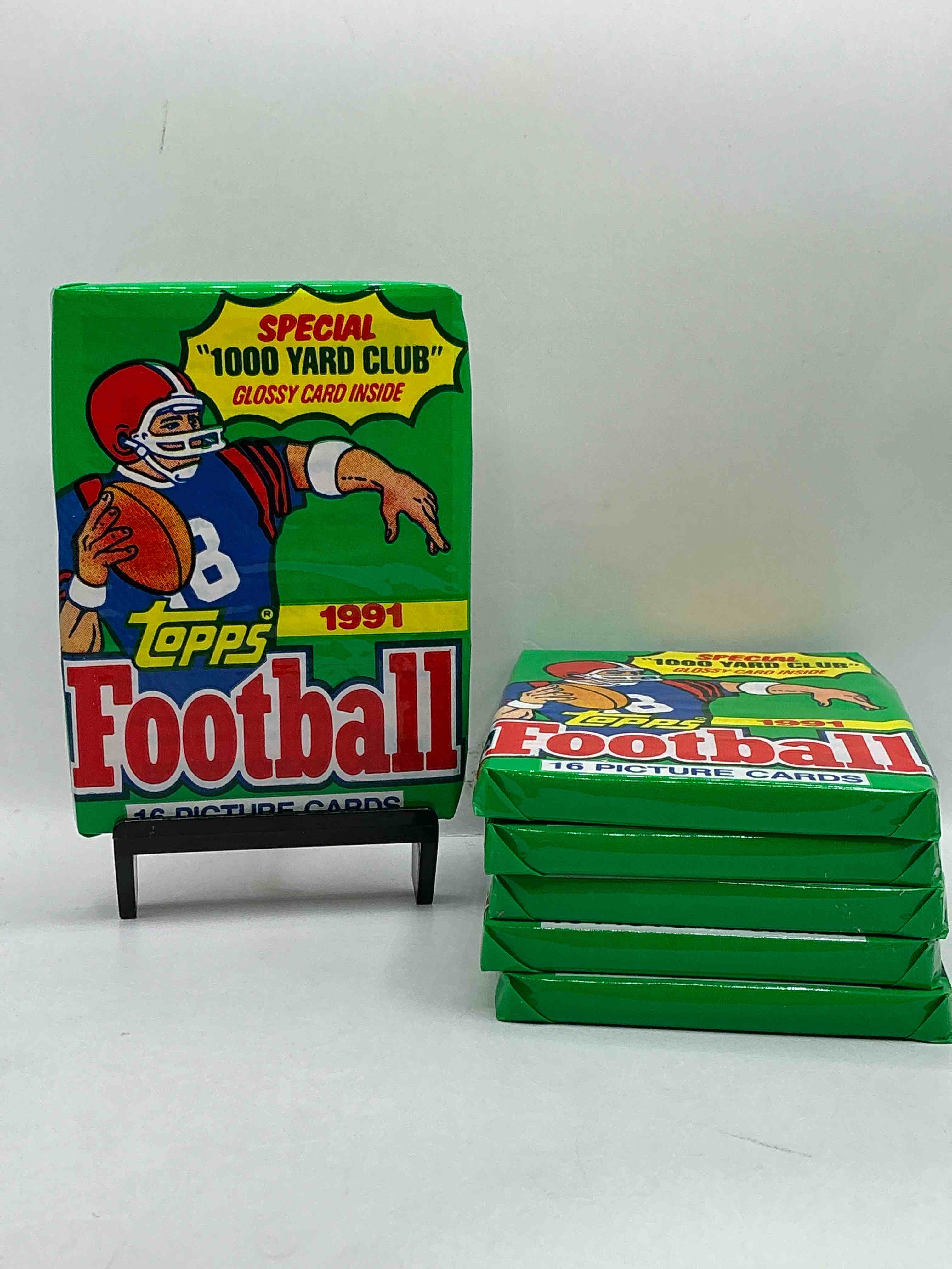 1991 topps football unopened sports card wax pack, direct from original retail case. search for early barry sanders, emmitt smith, jerry rice & joe montana!