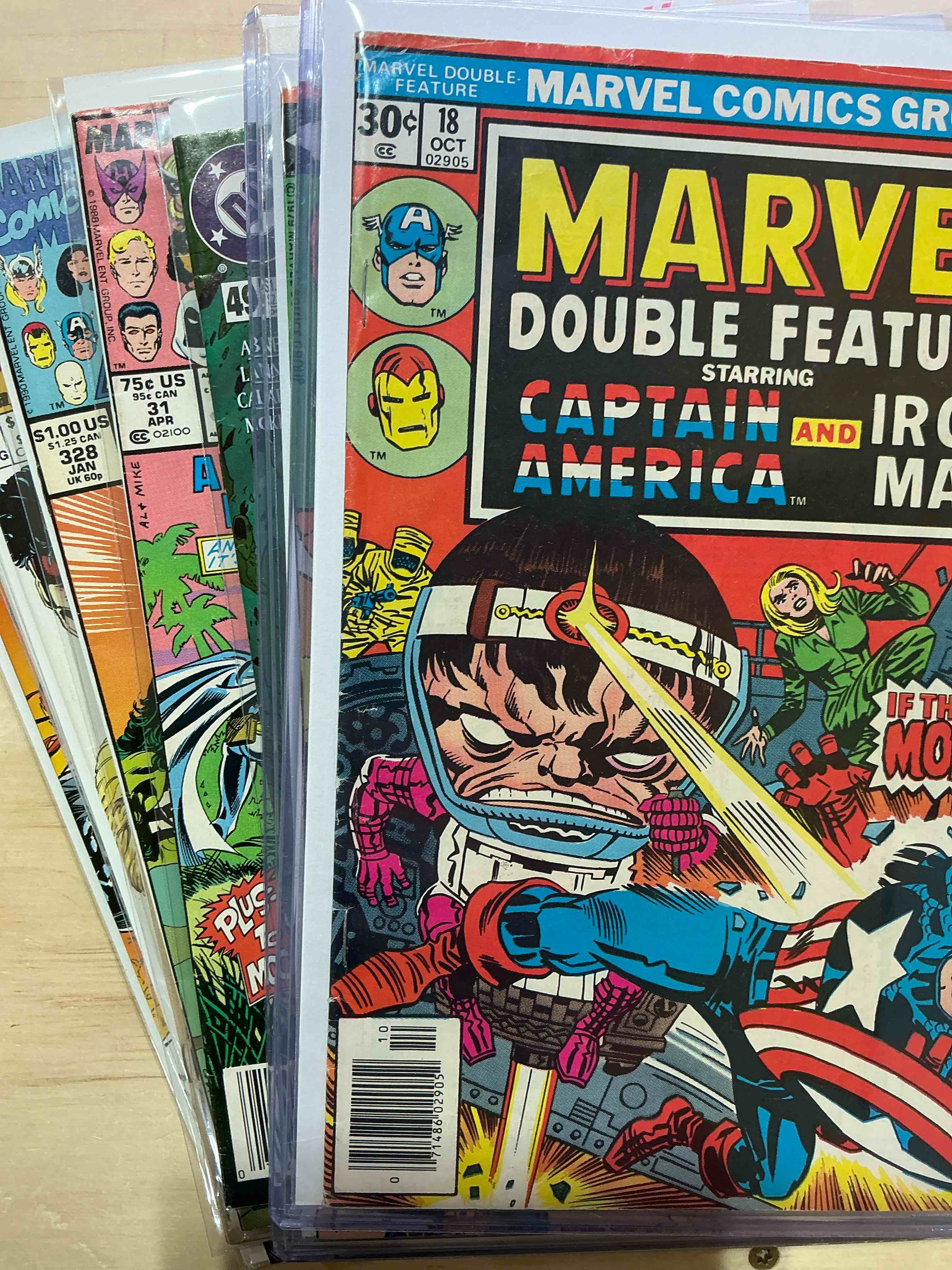 Condition photo showing New/Like New for comic book craziness!  12 awesome comic books spanning generations including authentic, original, early marvel, spider-man & more! wow! comics in nice/good condition & all come in protective casing!  