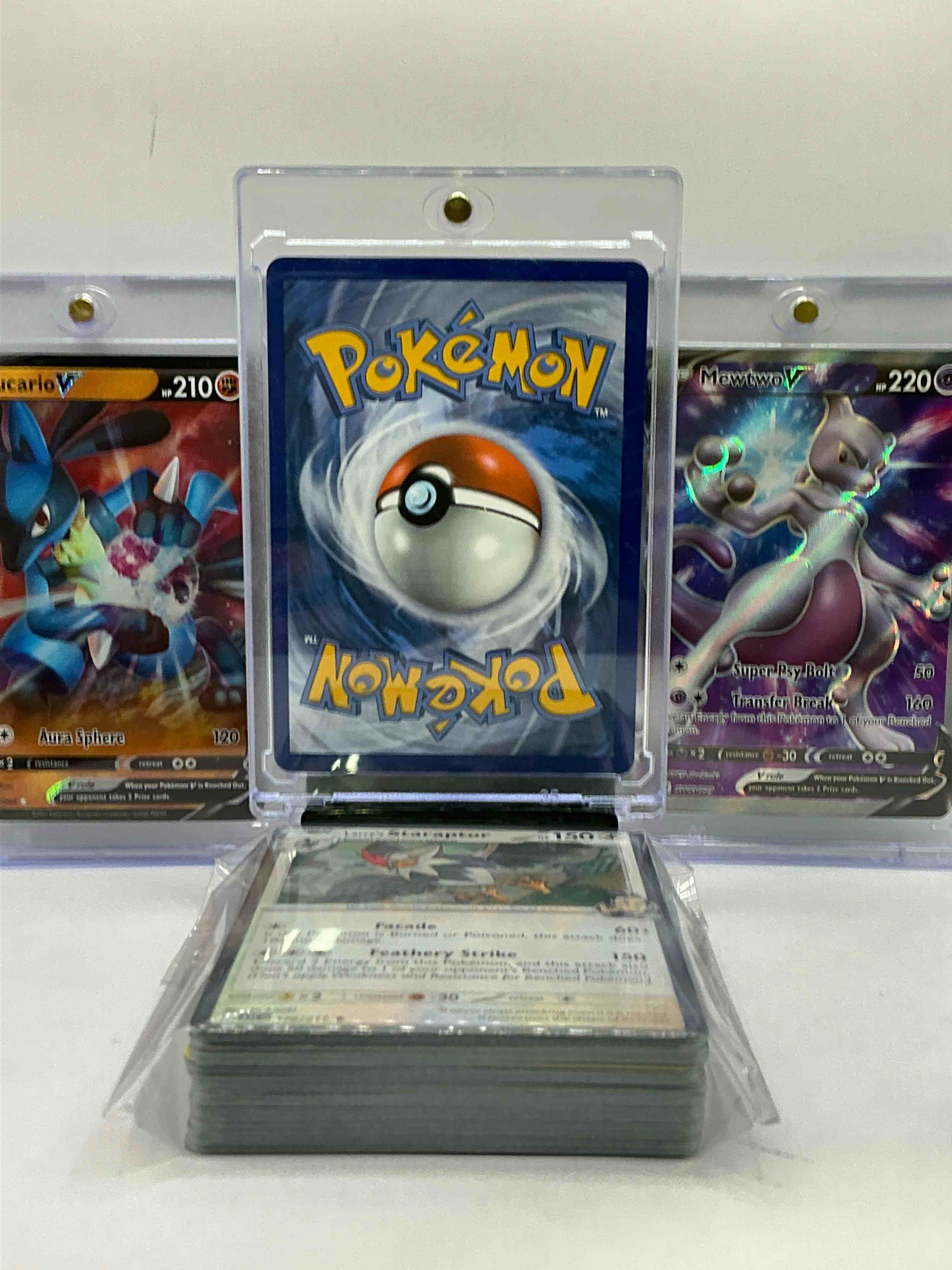 Condition photo showing New/Like New for surfing pikachu, lucario v & mewtwo v & more! along with 50 other pokémon heroes, holos, legends & commons- including 1 stage two rare holographic, 2 stage one rare holographic, 3 basic rare holographic, 4 common/ uncommon holographics (all stages), 2 stage two non holographic & 2 rares! also includes 36 non holo common/ uncommon basic & first stage cards trainers & energy too! perfect set for collectors & enthusiasts!