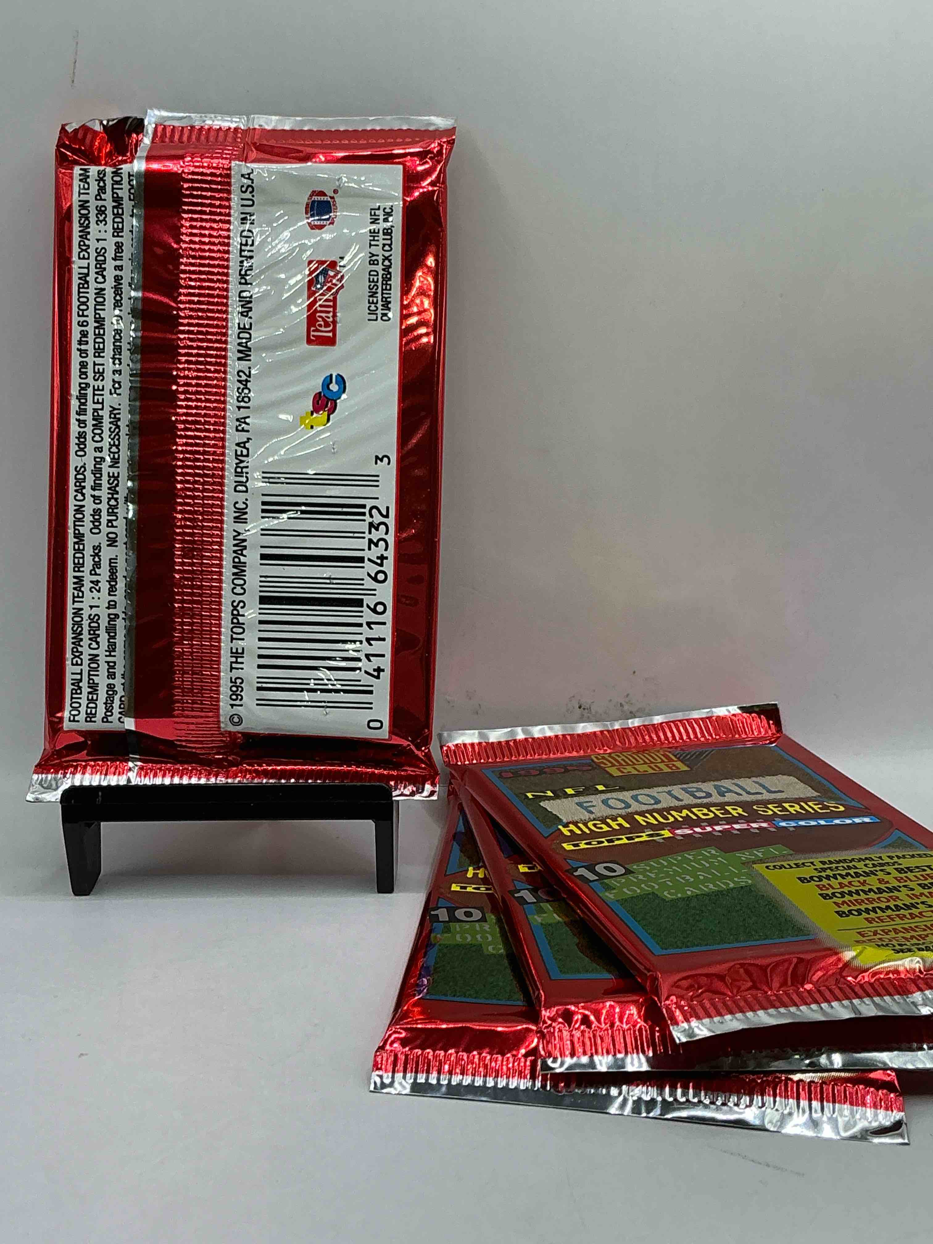Condition photo showing New/Like New for 1995 nfl football high number series topps stadium club super color! 10 super premium nfl football cards! collect randomly packed cards, bowman’s best, black & blue, mirror image, refractors & more! rare packs!
