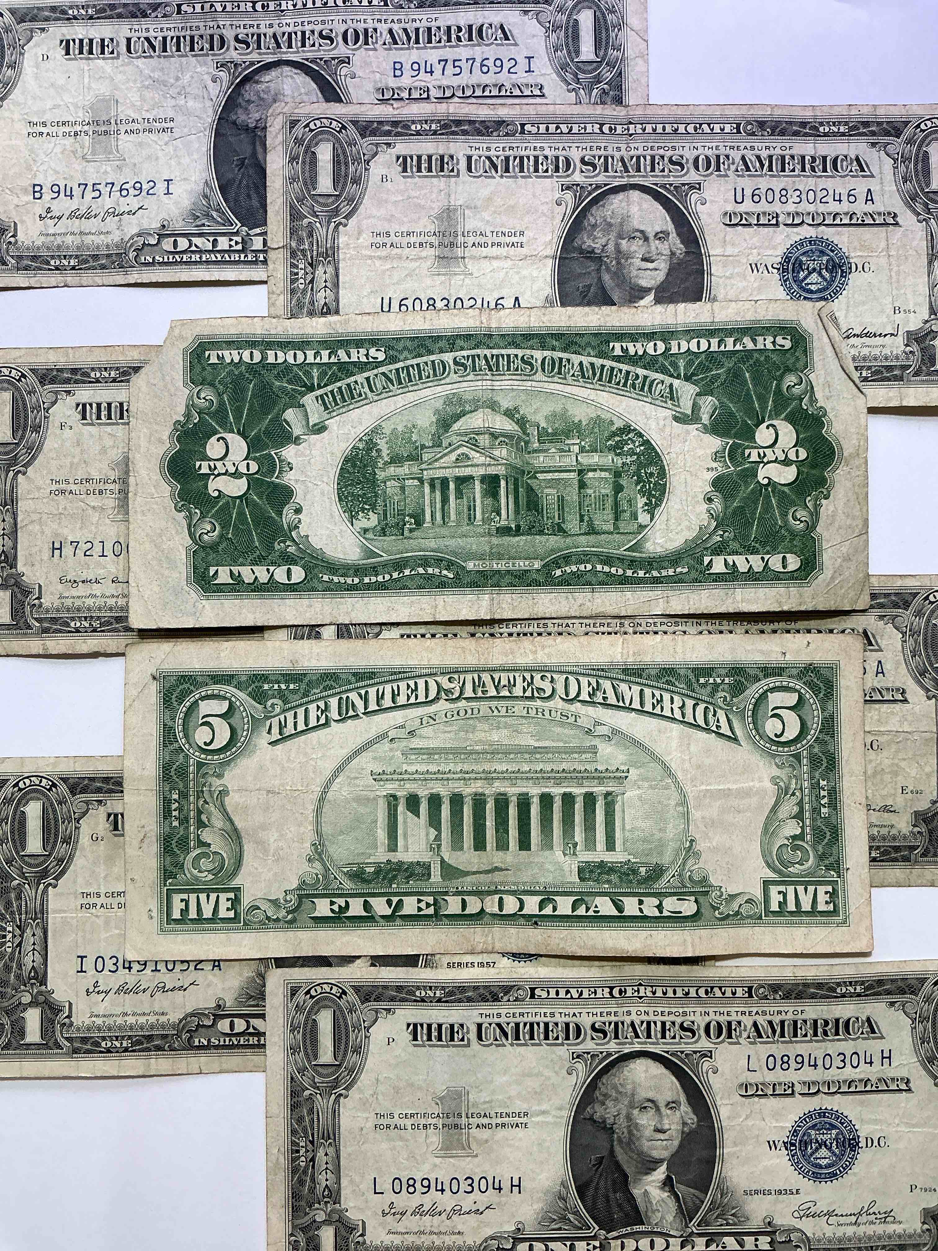 Condition photo showing Good Condition for rare american dollar bills! red seal five dollar bill & red seal two dollar bill, along with silver certificates! five dollar bill ultra rare & in good condition, red seal two dollar bill in good condition & silver certificates produced from 1878 to 1964 & are still considered legal tender at face value. here are gorgeous, circulated 1935 & 1957 u.s. one dollar silver certificate, with highly collectible "blue seal!* own an awesome piece of history! american dollar lot! 