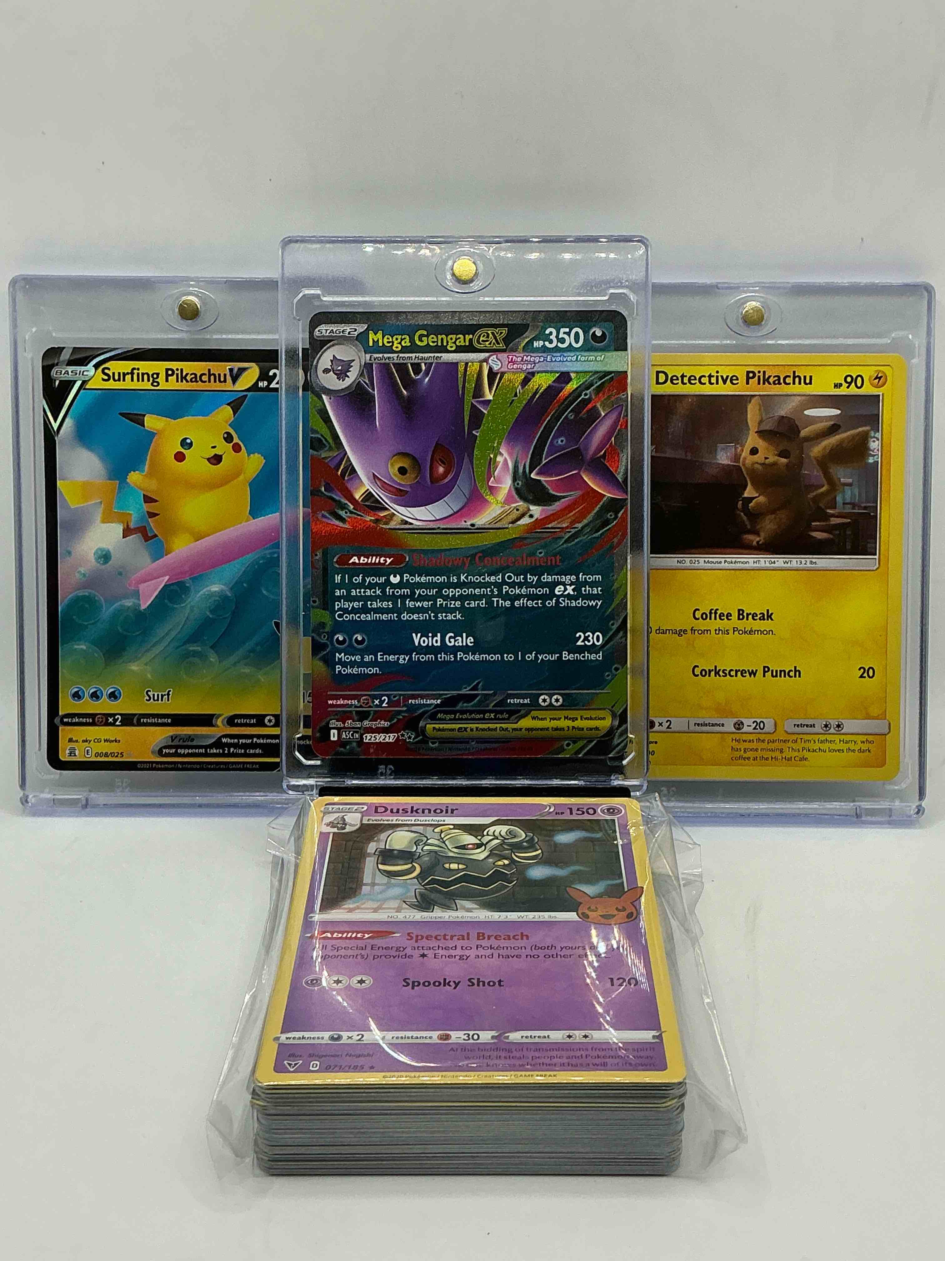 Pokémon Palooza! Mega Gengar EX! Surfing Pikachu V! Detective Pikachu! Along With 50 Other Pokémon Heroes, Holos, Legends & Commons- Including 1 Stage Two Rare Holographic, 2 Stage One Rare Holographic, 3 Basic Rare Holographic, 4 Common/ Uncommon Holographics (All Stages), 2 Stage Two Non Holographic & 2 Rares! Also Includes 36 Non Holo Common/ Uncommon Basic & First Stage Cards Trainers & Energy Too! Perfect Set For Collectors & Enthusiasts!