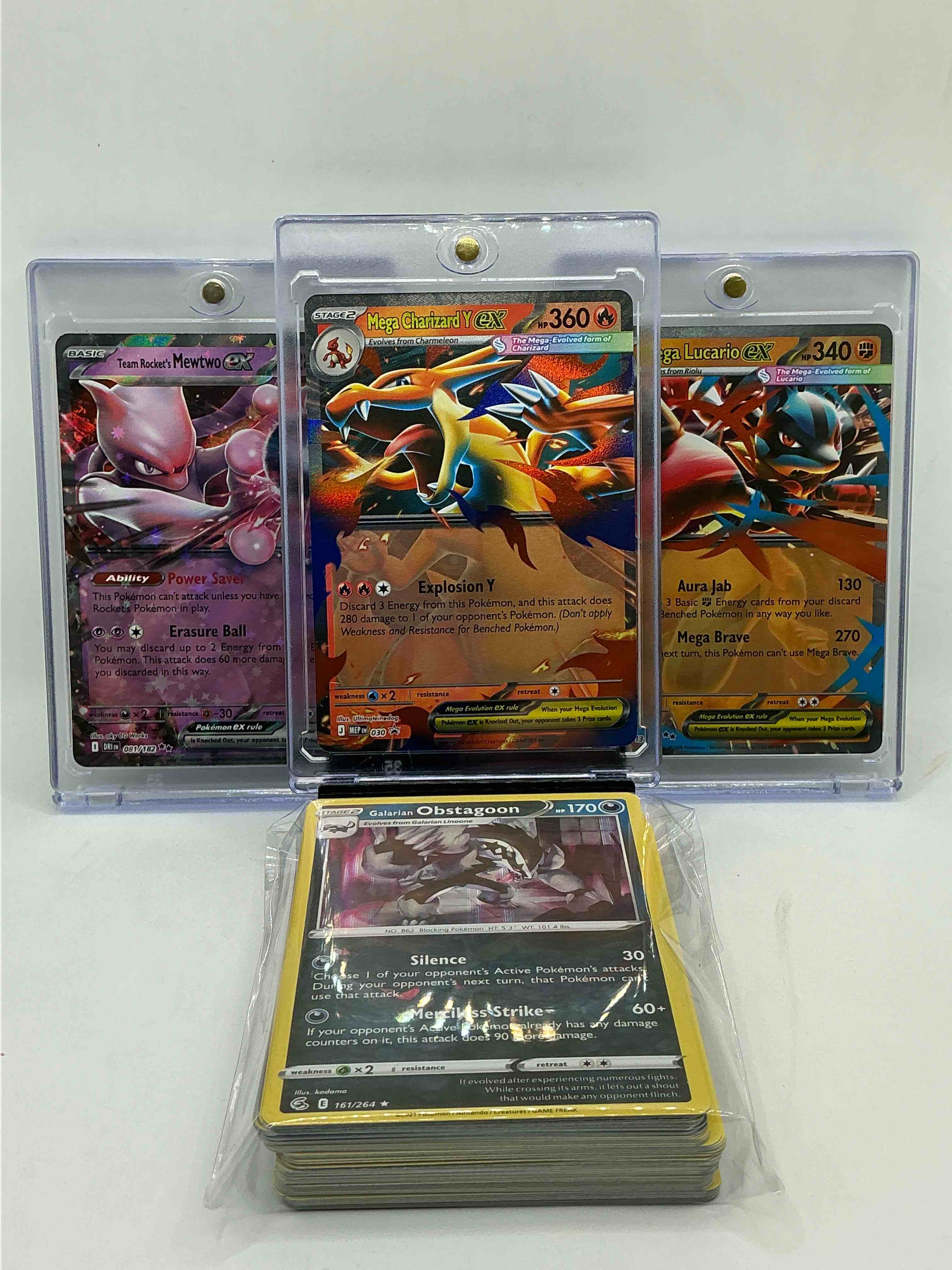 pokémon palooza! mega charizard y ex! mega lucario ex! team rocket’s mewtwo ex! along with 50 other pokémon heroes, holos, legends & commons- including 1 stage two rare holographic, 2 stage one rare holographic, 3 basic rare holographic, 4 common/ uncommon holographics (all stages), 2 stage two non holographic & 2 rares! also includes 36 non holo common/ uncommon basic & first stage cards trainers & energy too! perfect set for collectors & enthusiasts!