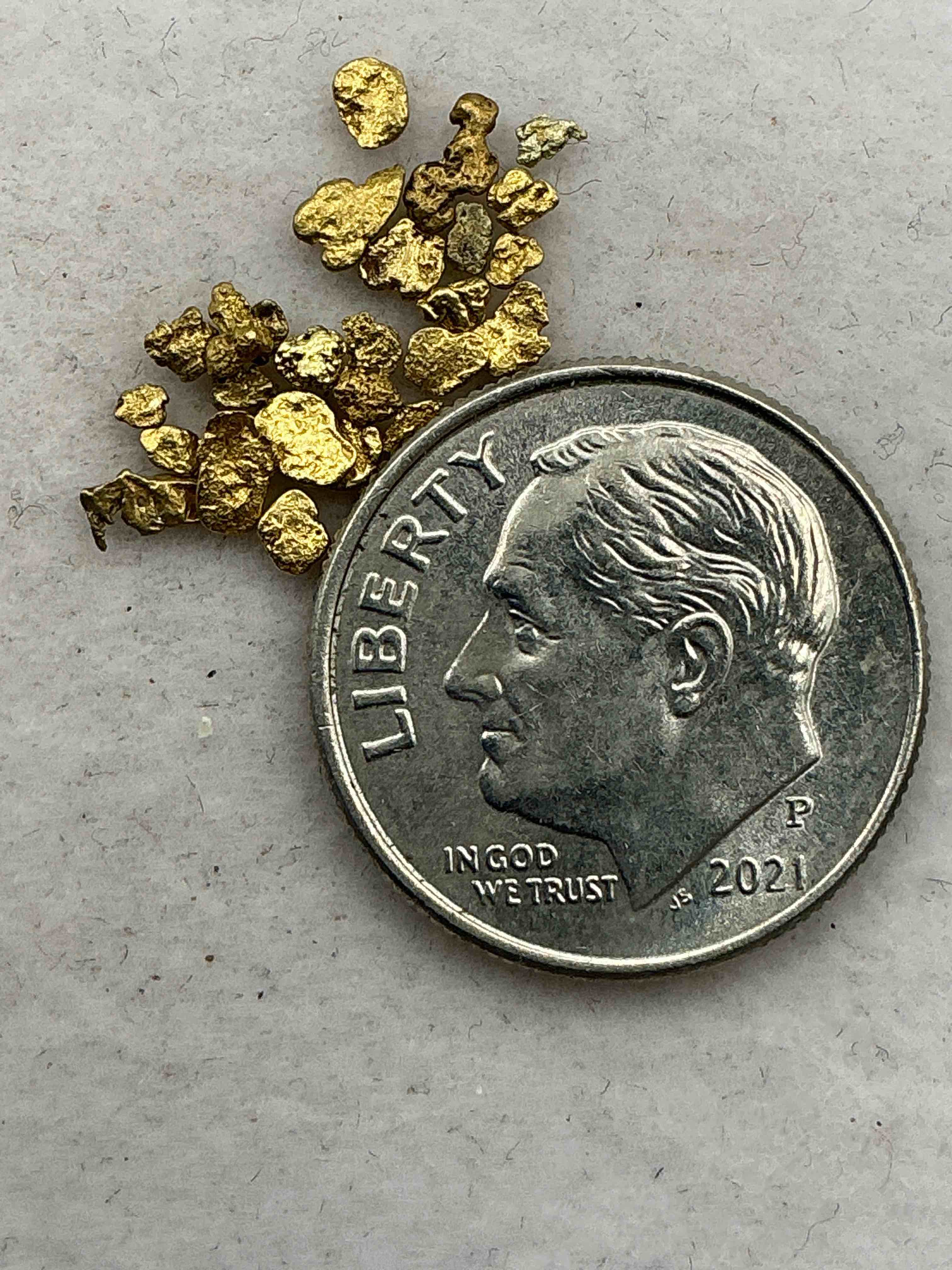 Genuine Gold Nuggets! Gold Nuggets Fresh From Prospecting North Carolina Mountains, Total Weight Of All Nuggets Is Approximately .5 Grams. These Gold Nuggets Typically Test At Between Approx 22-24 Karat. Gold In Raw, Prospected Form Is Extremely Hard To Find & Much Rarer Than Any Refined Form. Get In On The Gold Craze... Gold Has Increased In Value Over 40% Since 2025! U.S. Dime For Size Reference Only (not included). Gold Vile In Image Included. Own Genuine, Gold Nuggets! 