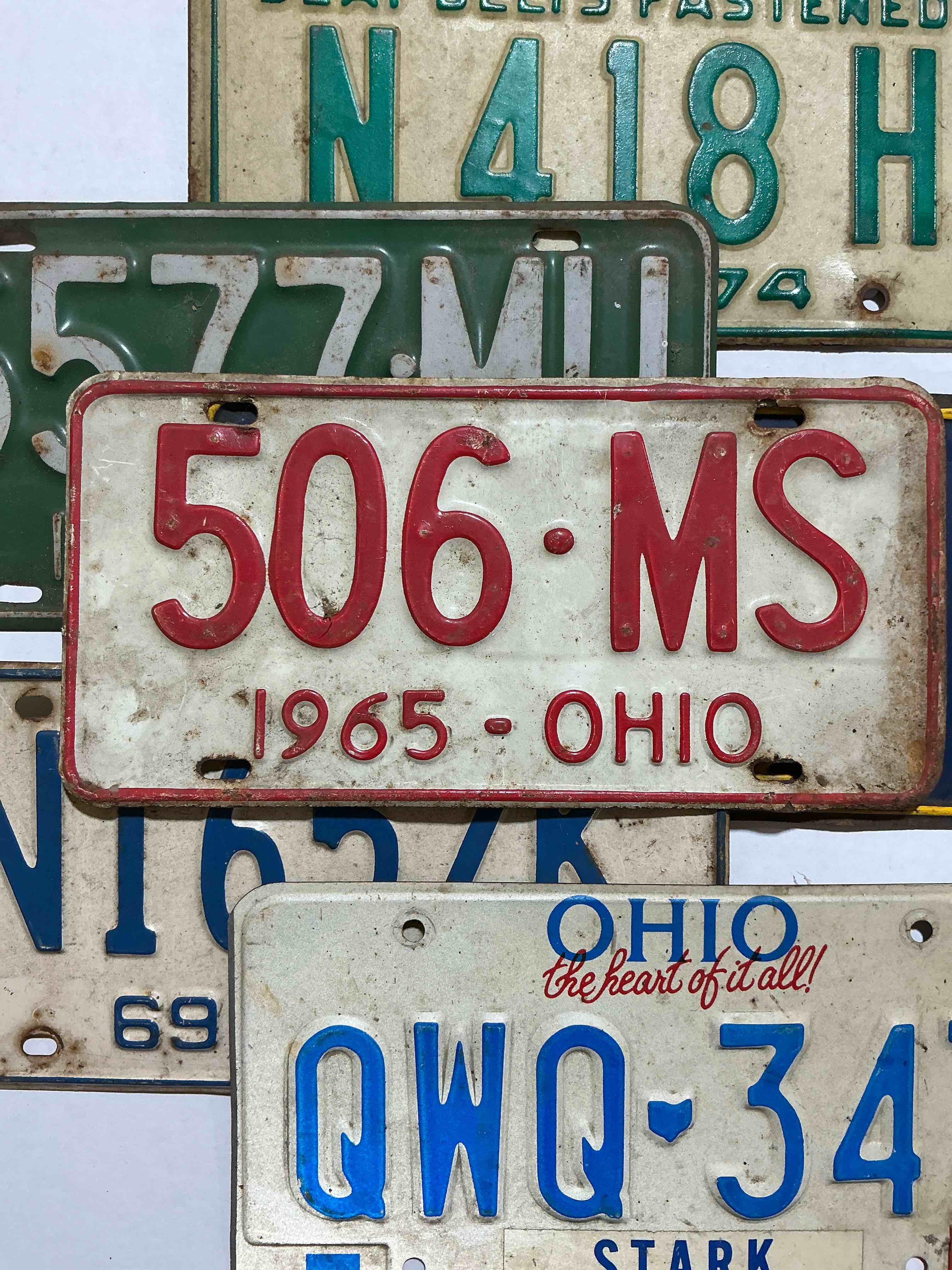 license plate history, wow!  authentic, original ohio license plates spanning multiple decades!  these are genuine heavy metal time pieces, not replicas!  some rust & barn dust included!  almost impossible to find!  