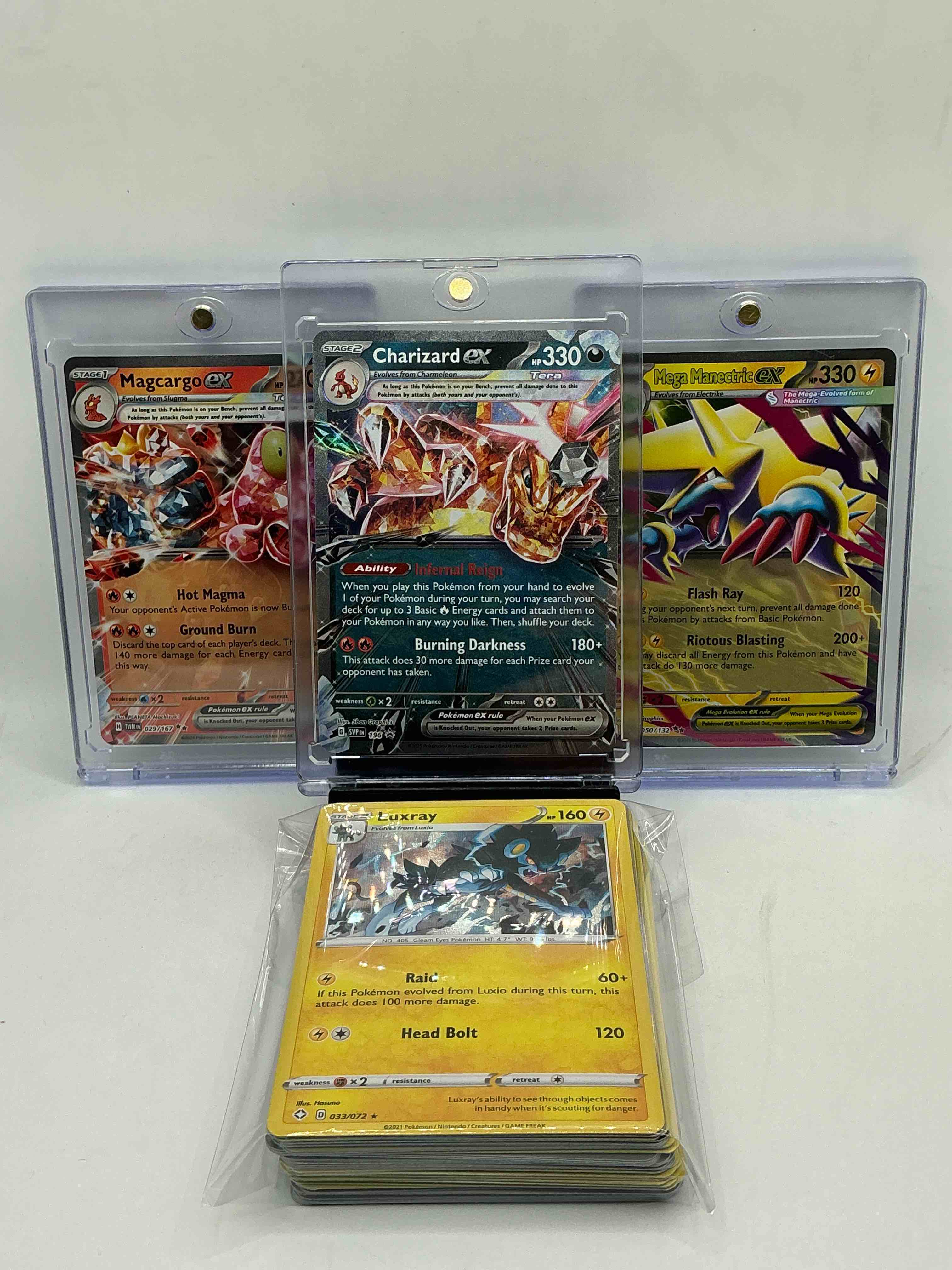 pokémon party! charizard ex! mega manectric ex! magcargo ex! along with 50 other pokémon heroes, holos, legends & commons- including 1 stage two rare holographic, 2 stage one rare holographic, 3 basic rare holographic, 4 common/ uncommon holographics (all stages), 2 stage two non holographic & 2 rares! also includes 36 non holo common/ uncommon basic & first stage cards trainers & energy too! perfect set for collectors & enthusiasts!