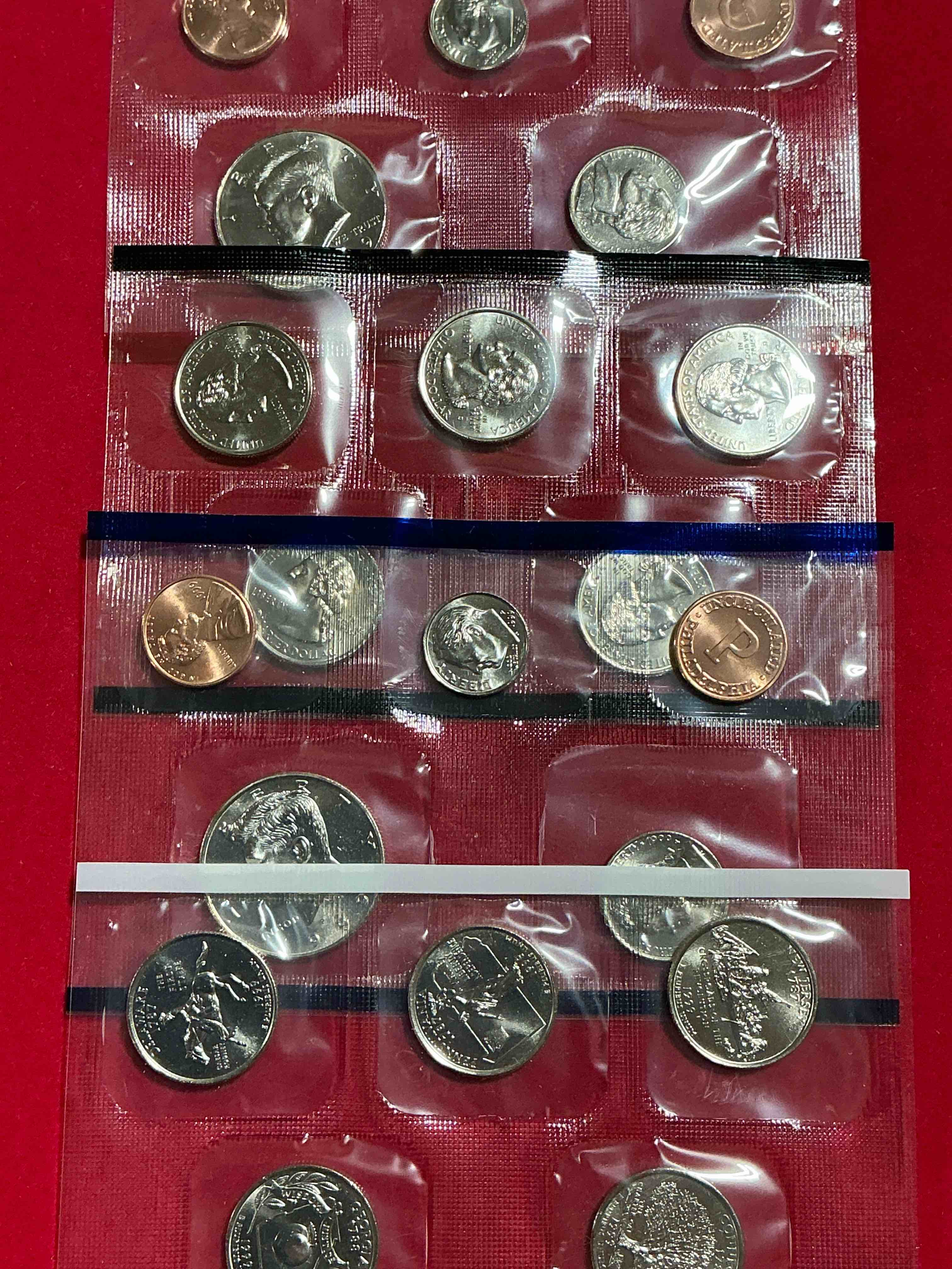 Condition photo showing New/Like New for 1999 uncirculated mint set coins! 20 coin mint set from philadelphia & denver! 20 coin uncirculated lot, with quarters, nickels, half dollars, dimes, pennies & more! uncirculated coin craziness!