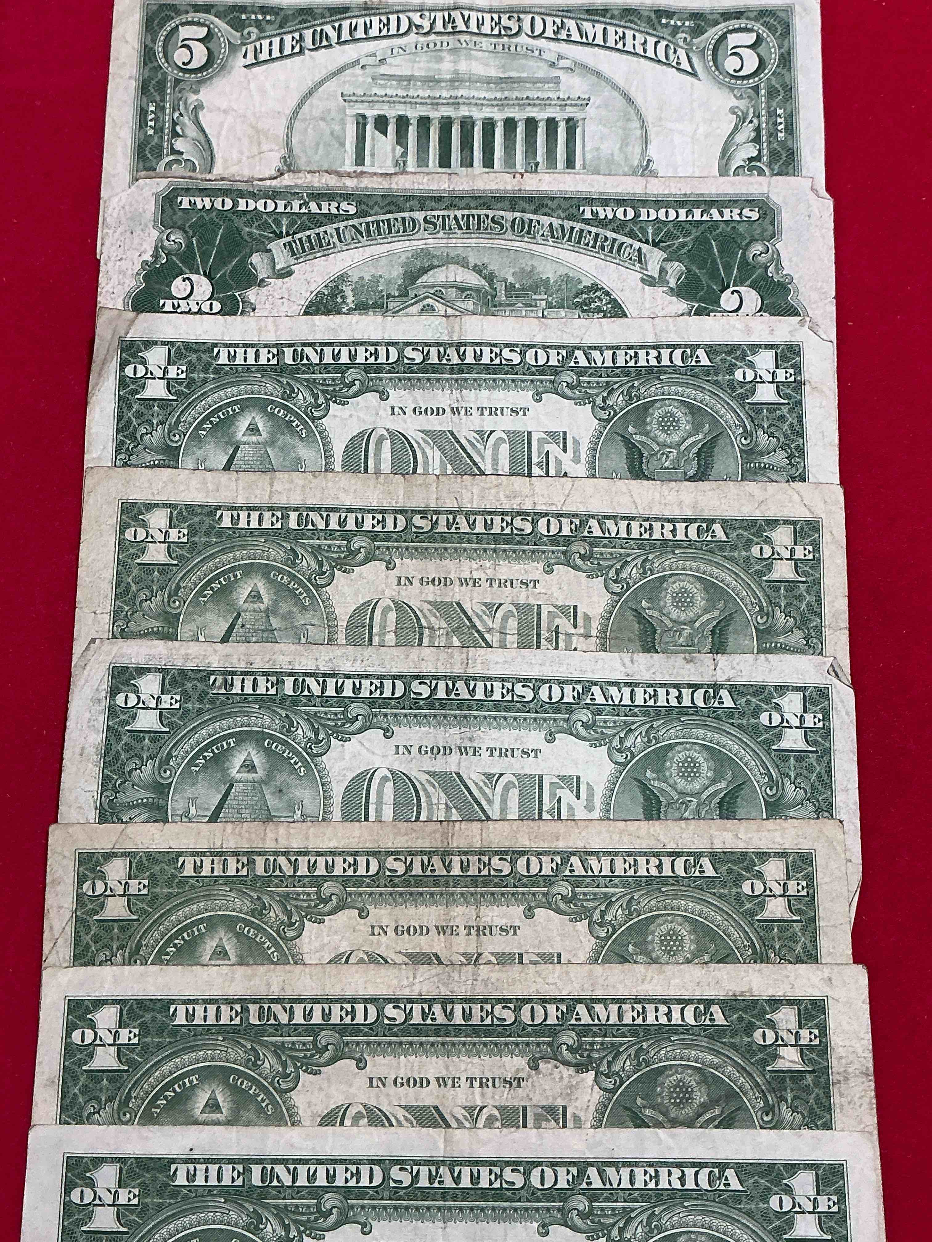 Condition photo showing Good Condition for rare american dollar bills! red seal five dollar bill & red seal two dollar bill, along with silver certificates! five dollar bill ultra rare & in good condition, red seal two dollar bill in good condition & silver certificates produced from 1878 to 1964 & are still considered legal tender at face value. here are gorgeous, circulated 1935 & 1957 u.s. one dollar silver certificate, with highly collectible "blue seal!* own an awesome piece of history! american dollar lot! 