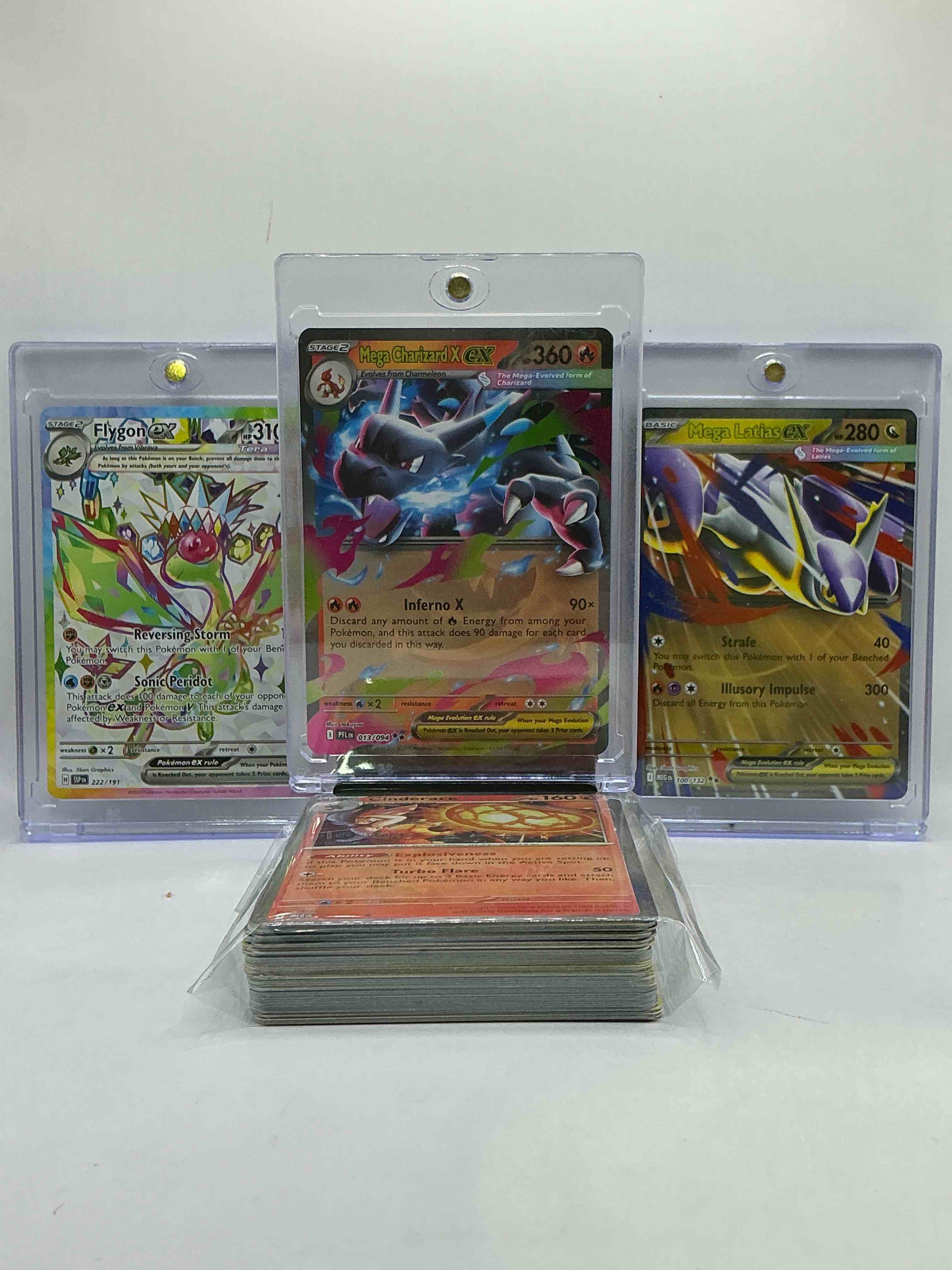 Condition photo showing New/Like New for mega charizard ex & mega latias ex! along with flygon ex & more! along with 50 other pokémon heroes, holos, legends & commons- including 1 stage two rare holographic, 2 stage one rare holographic, 3 basic rare holographic, 4 common/ uncommon holographics (all stages), 2 stage two non holographic & 2 rares! also includes 36 non holo common/ uncommon basic & first stage cards trainers & energy too! perfect set for collectors & enthusiasts!