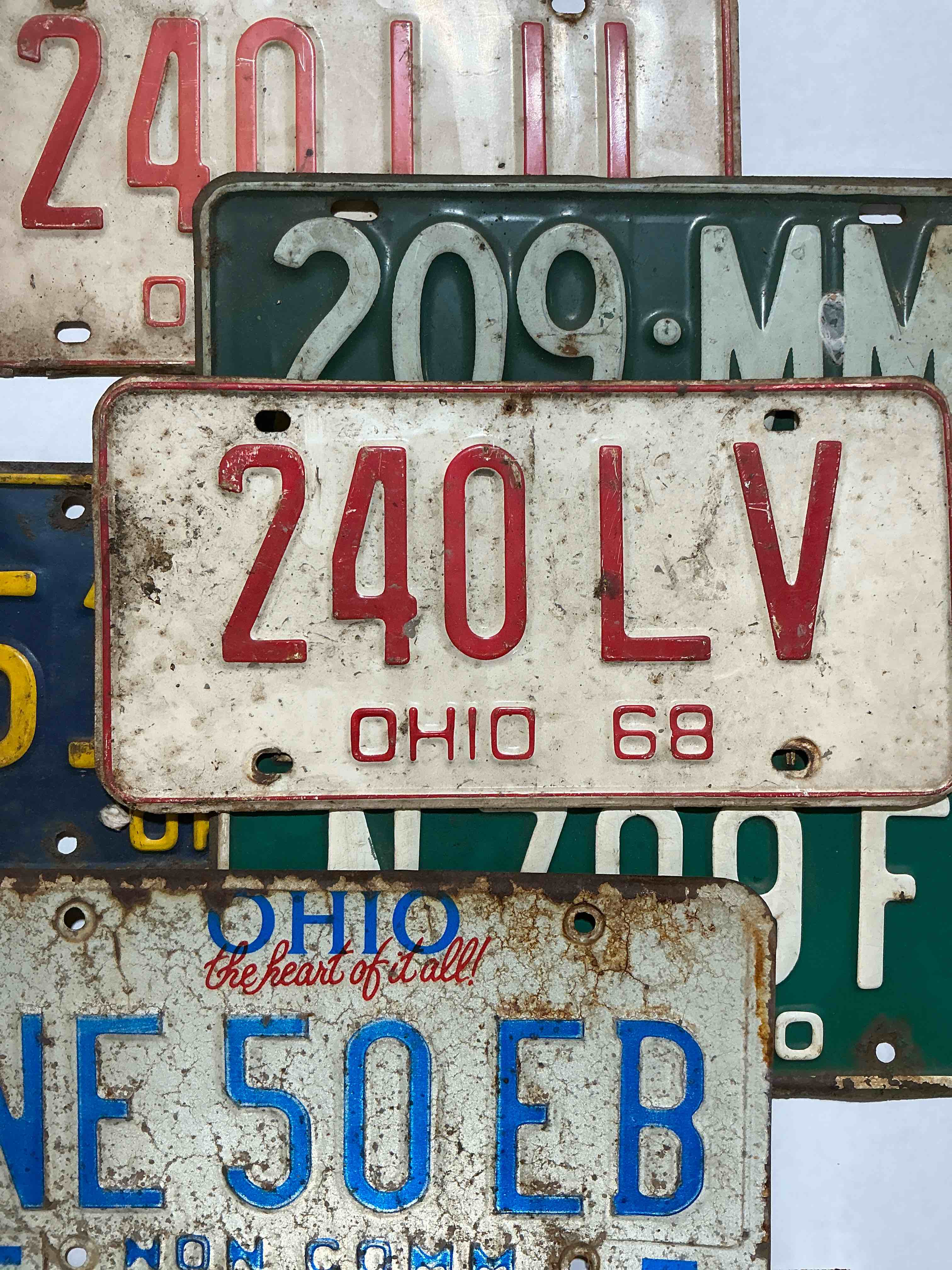 license plate history, wow!  authentic, original ohio license plates spanning multiple decades!  these are genuine heavy metal time pieces, not replicas!  some rust & barn dust included!  almost impossible to find!  