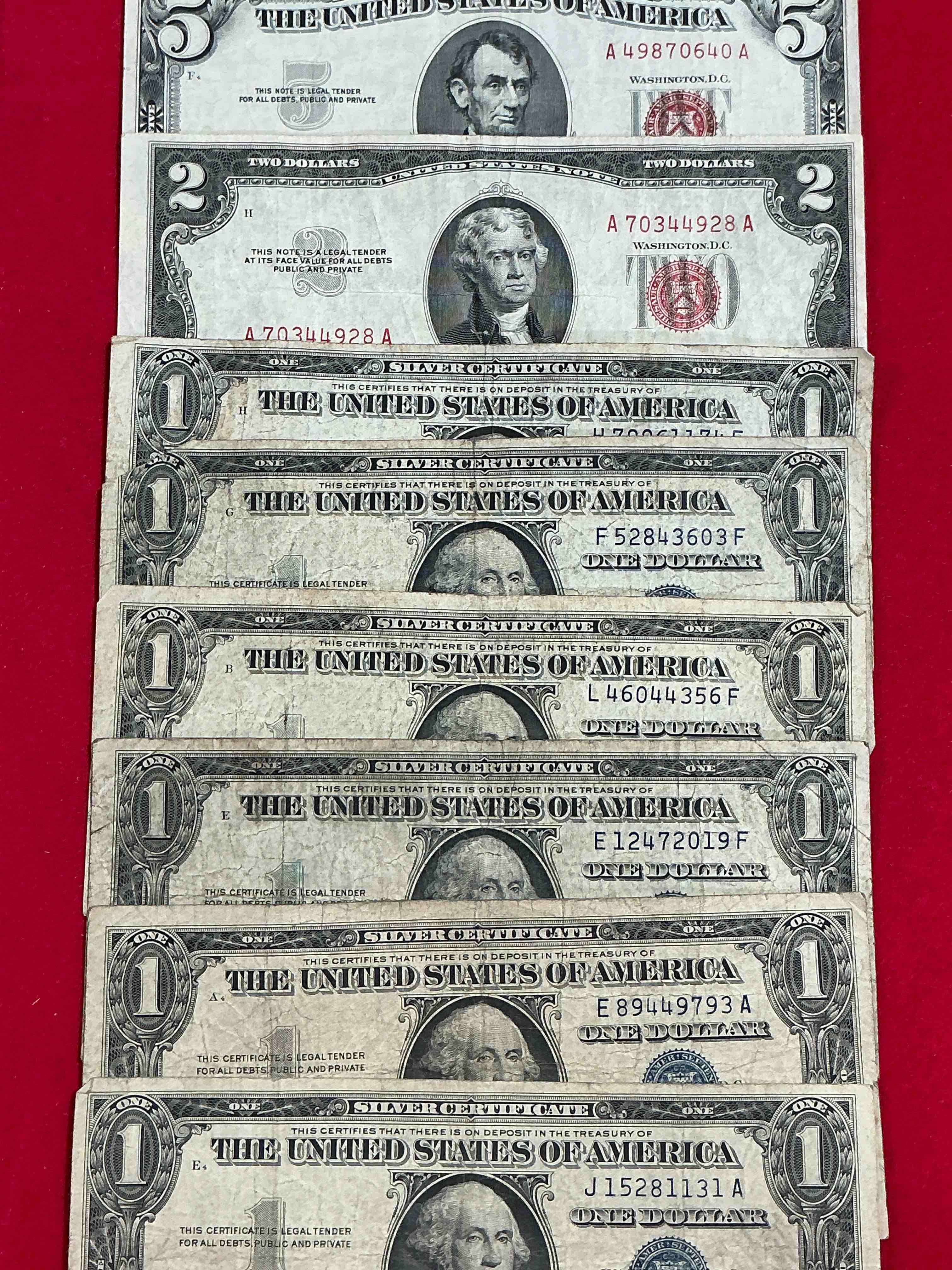 Rare American Dollar Bills! Red Seal Five Dollar Bill & Red Seal Two Dollar Bill, Along With Silver Certificates! Five Dollar Bill Ultra Rare & In Good Condition, Red Seal Two Dollar Bill In Good Condition & Silver Certificates Produced From 1878 To 1964 & Are Still Considered Legal Tender At Face Value. Here Are Gorgeous, Circulated 1935 & 1957 U.S. One Dollar Silver Certificate, With Highly Collectible "Blue Seal!* Own An Awesome Piece Of History! American Dollar Lot! 