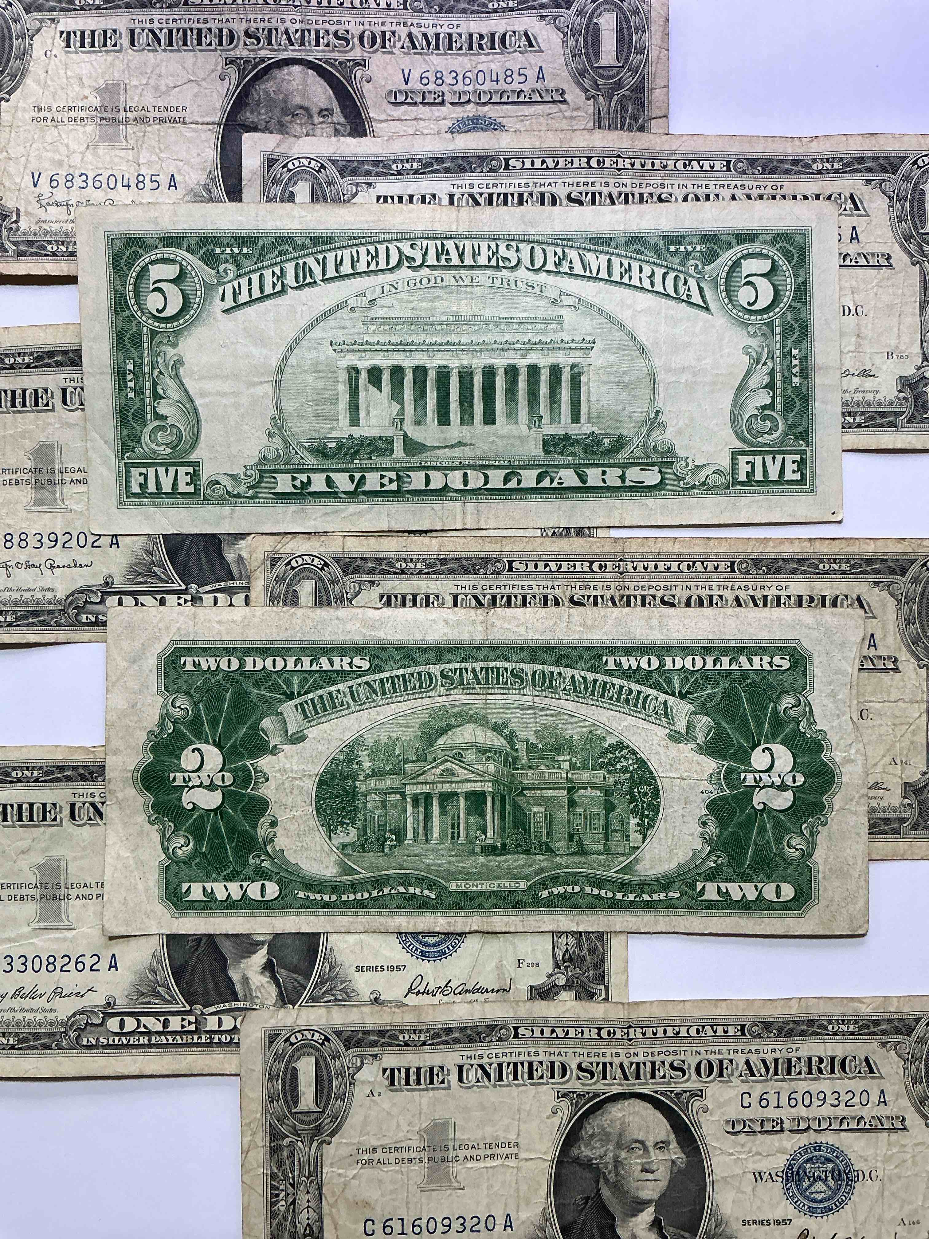 Condition photo showing New/Like New for rare american dollar bills! red seal five dollar bill & red seal two dollar bill, along with silver certificates! five dollar bill ultra rare & in good condition, red seal two dollar bill in good condition & silver certificates produced from 1878 to 1964 & are still considered legal tender at face value. here are gorgeous, circulated 1935 & 1957 u.s. one dollar silver certificate, with highly collectible "blue seal!* own an awesome piece of history! american dollar lot! 