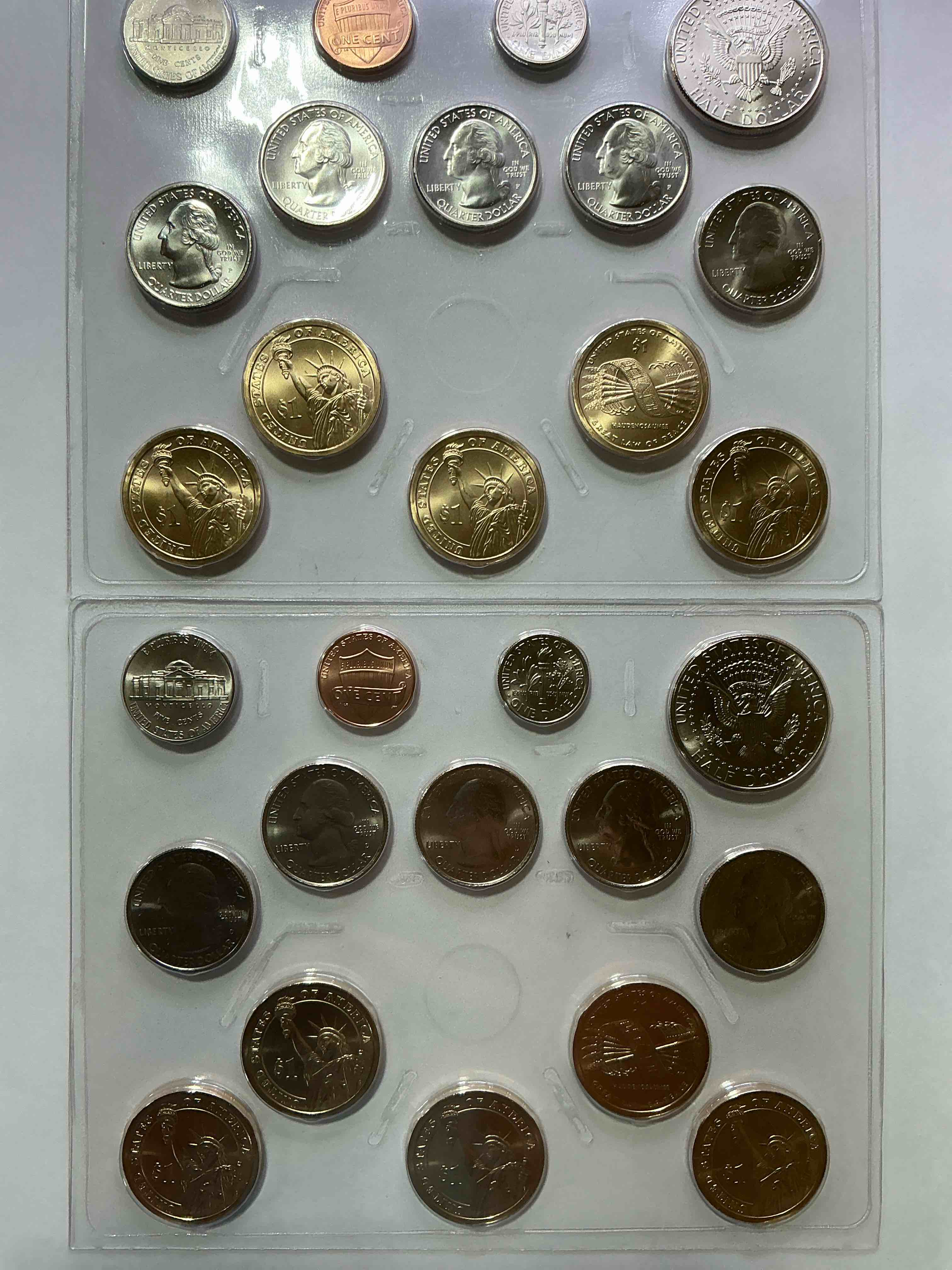 2010 uncirculated mint coins! 28 coin lot, with multiple dollar coins, half dollars, quarters, dimes, nickels & pennies! wow!