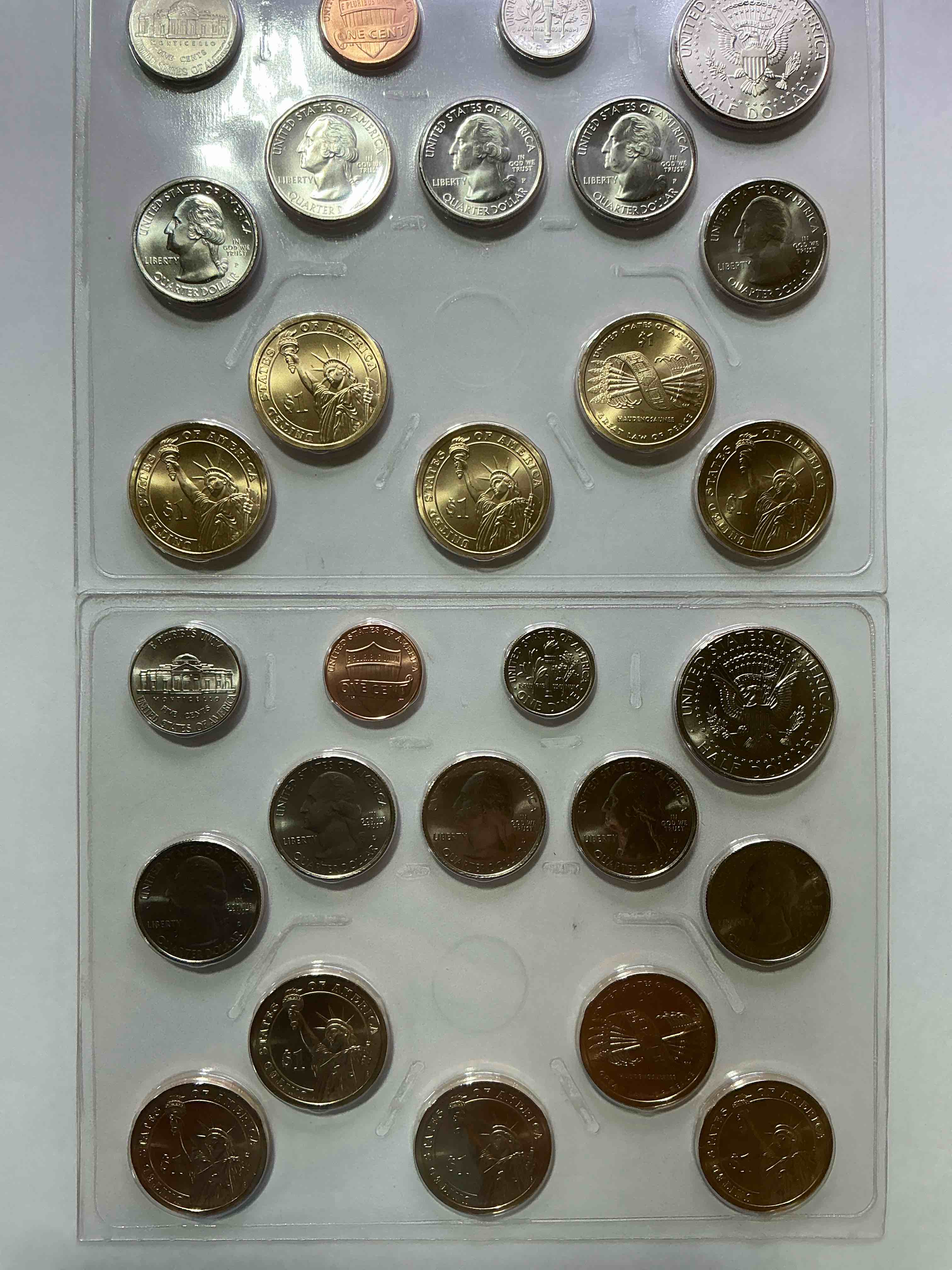 Condition photo showing New/Like New for 2010 uncirculated mint coins! 28 coin lot, with multiple dollar coins, half dollars, quarters, dimes, nickels & pennies! wow!