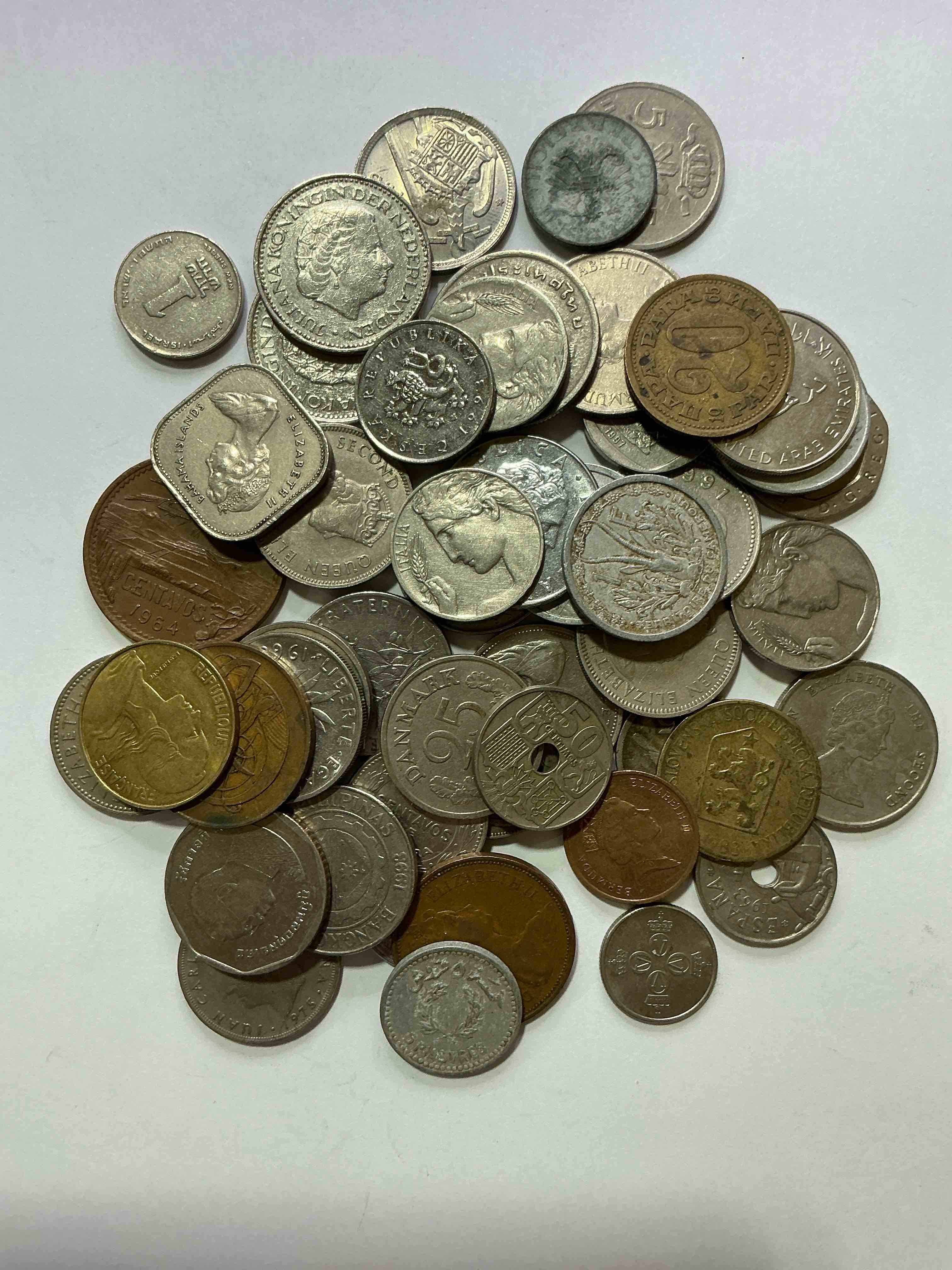 Condition photo showing Good Condition for world coins, antique & vintage! each lot is unique! many different years, countries, sizes & exotic places. this cool collection of antique coins from around the world is loads of fun! have fun identifying each coin & country as a great educational tool! a great investment too!