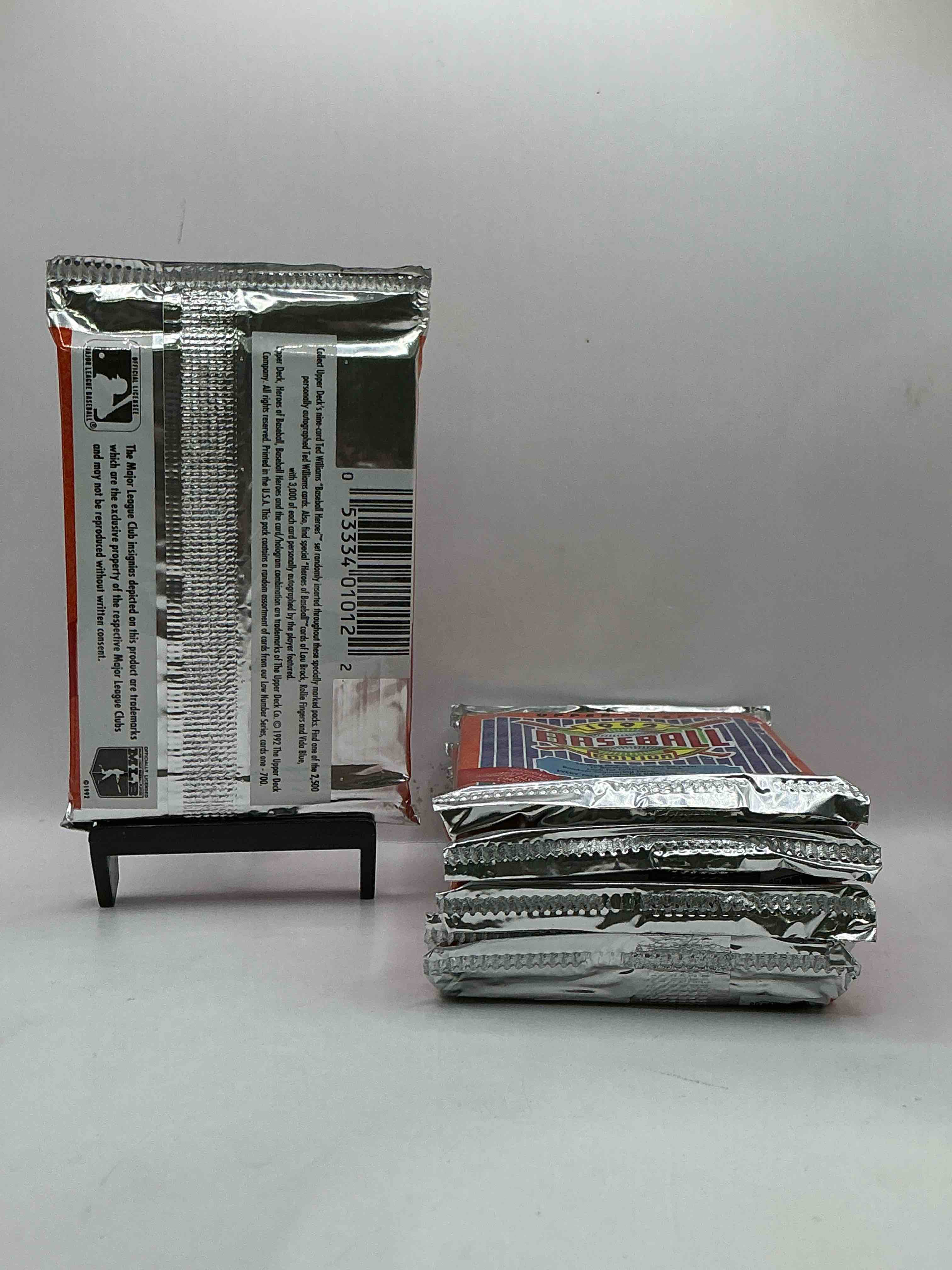 Condition photo showing New/Like New for 1992 upper deck baseball sealed sports & collectible card pack, direct from original sealed retail case! search for ultra rare & valuable ted williams & johnny bench signed insert cards as well as deion sanders, ken griffey jr., nolan ryan & so much more!