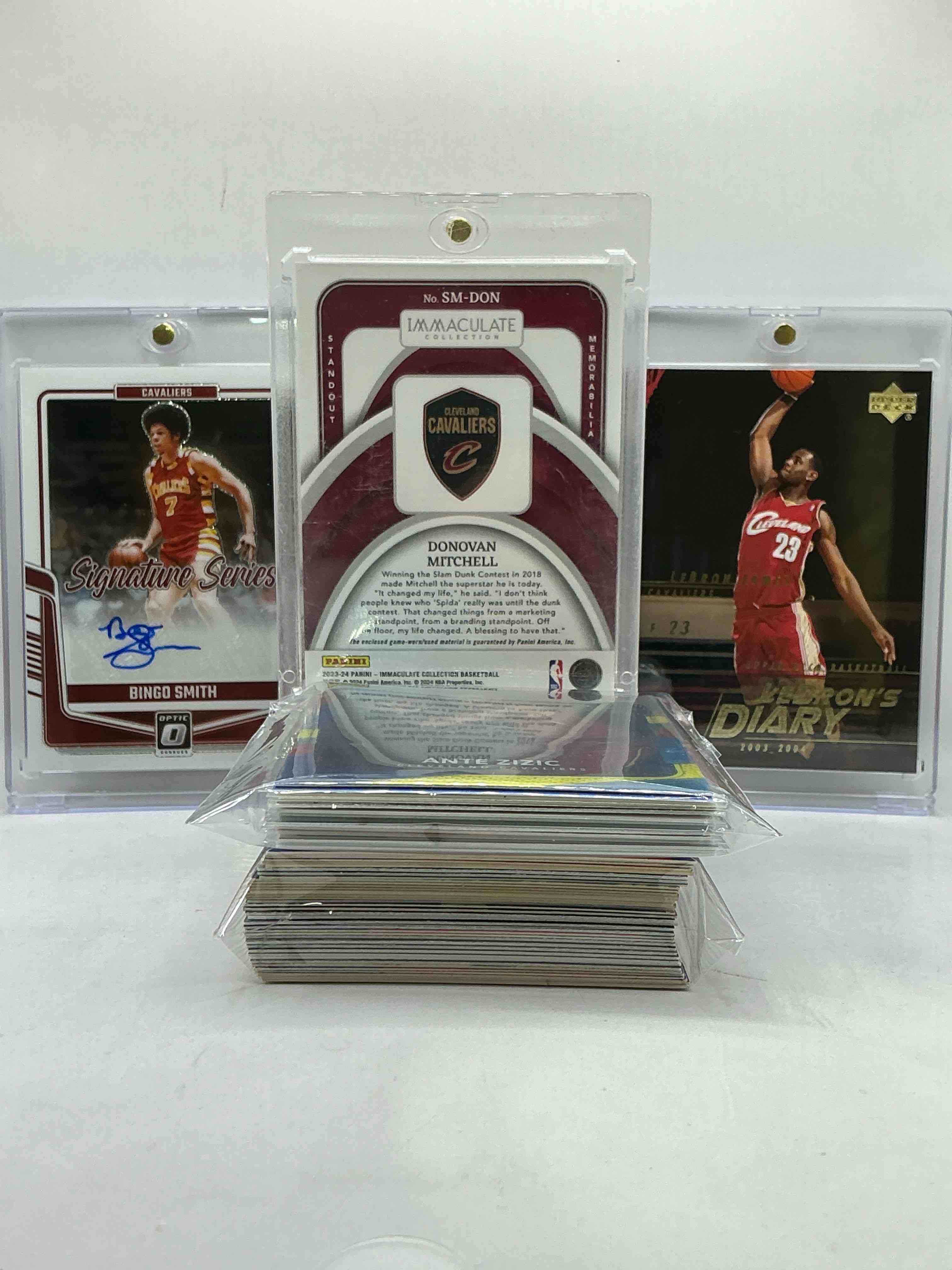 Condition photo showing New/Like New for donovan mitchell immaculate /99 jersey card! lebron james rookie card lebron’s diary & bingo smith optic signature card! wow! cleveland cavaliers craziness! this 50 card lot includes commons, legends, heroes, rookies & more! awesome & ultra rare!