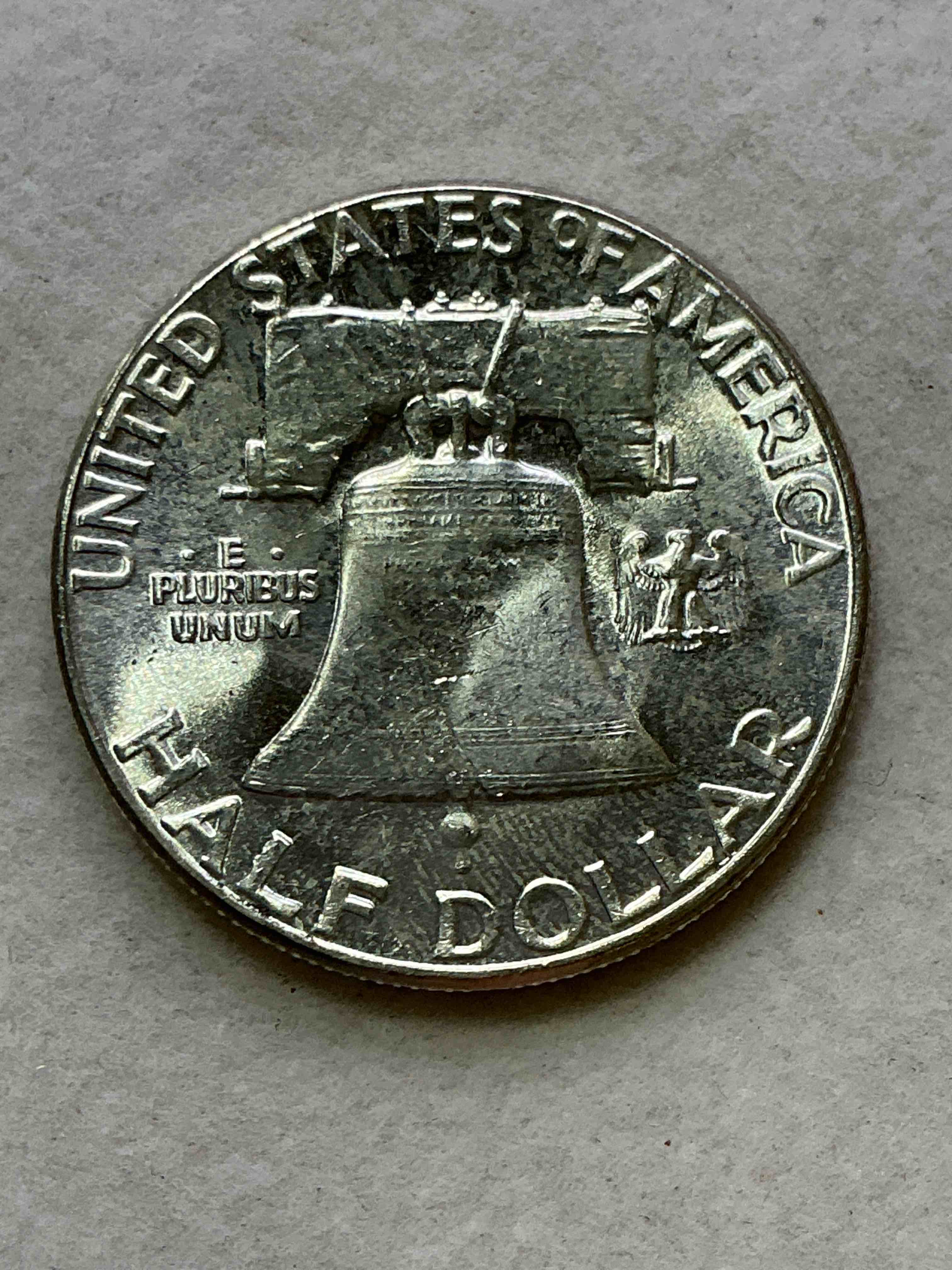Condition photo showing New/Like New for ben franklin uncirculated silver! pre 1965 silver u.s. half dollar coin! before 1965 american half dollars were actually silver, here is a rare 1960 version in good condition! great for investing in precious metals! these heavy half dollars were minted at 90% silver and 10% copper, giving them a net weight of .36169 ounces of pure silver per coin! very rare in this great condition!