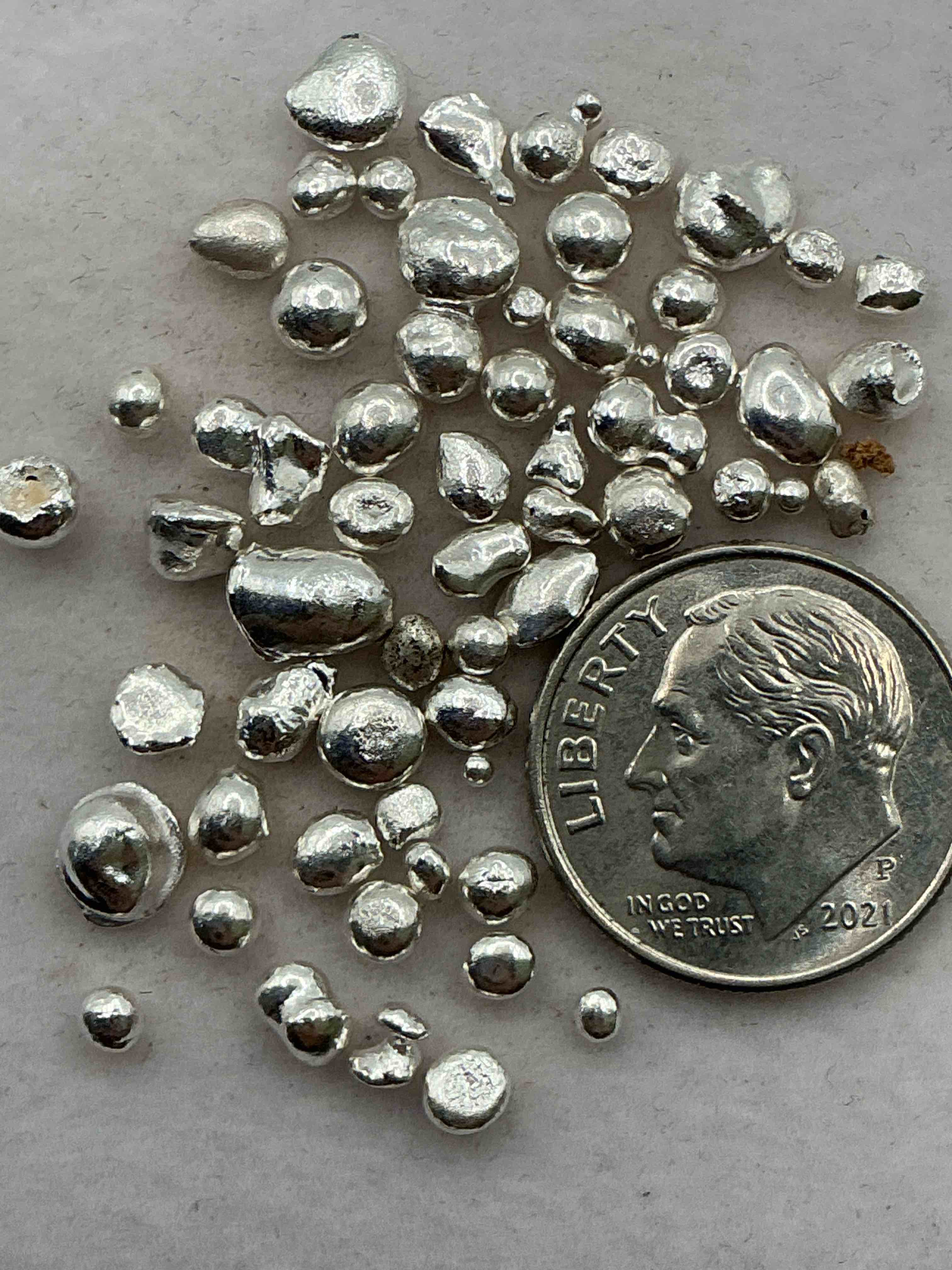 silver nuggets! .999 us fine silver, in small nugget form! total weight of all nuggets in lot approximately 9 grams, bid is per nugget! a cool way to invest in fine us silver!