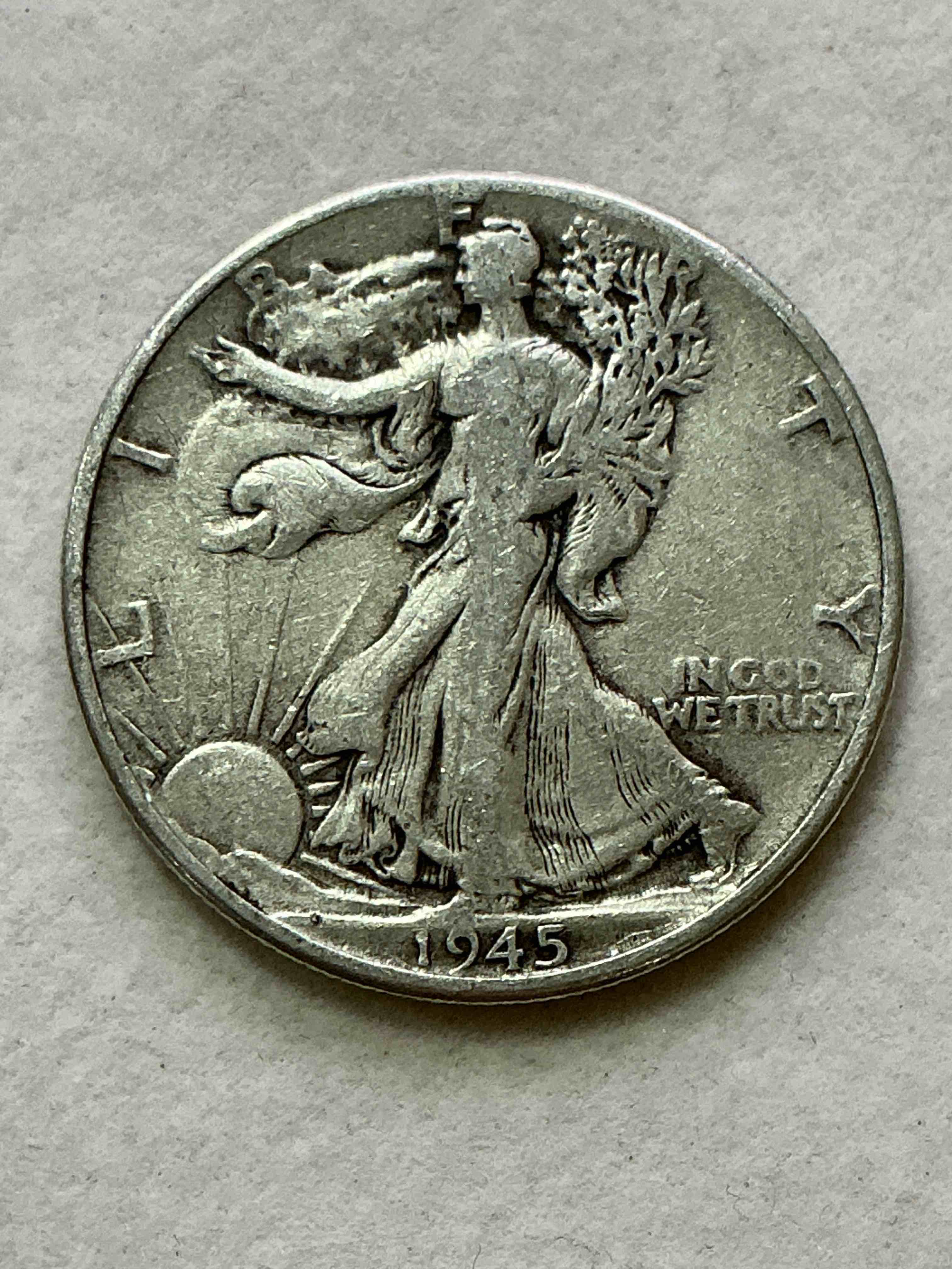 world war ii era silver! antique u.s. silver! liberty walking silver fine u.s. silver half dollar! this striking half dollars were minted from 1916-1947 & have become some of the most collectible coins in history! here is a striking appears uncirculated example from 1945! liberty walking coins are 90% fine u.s. silver, a great investment in precious metal!