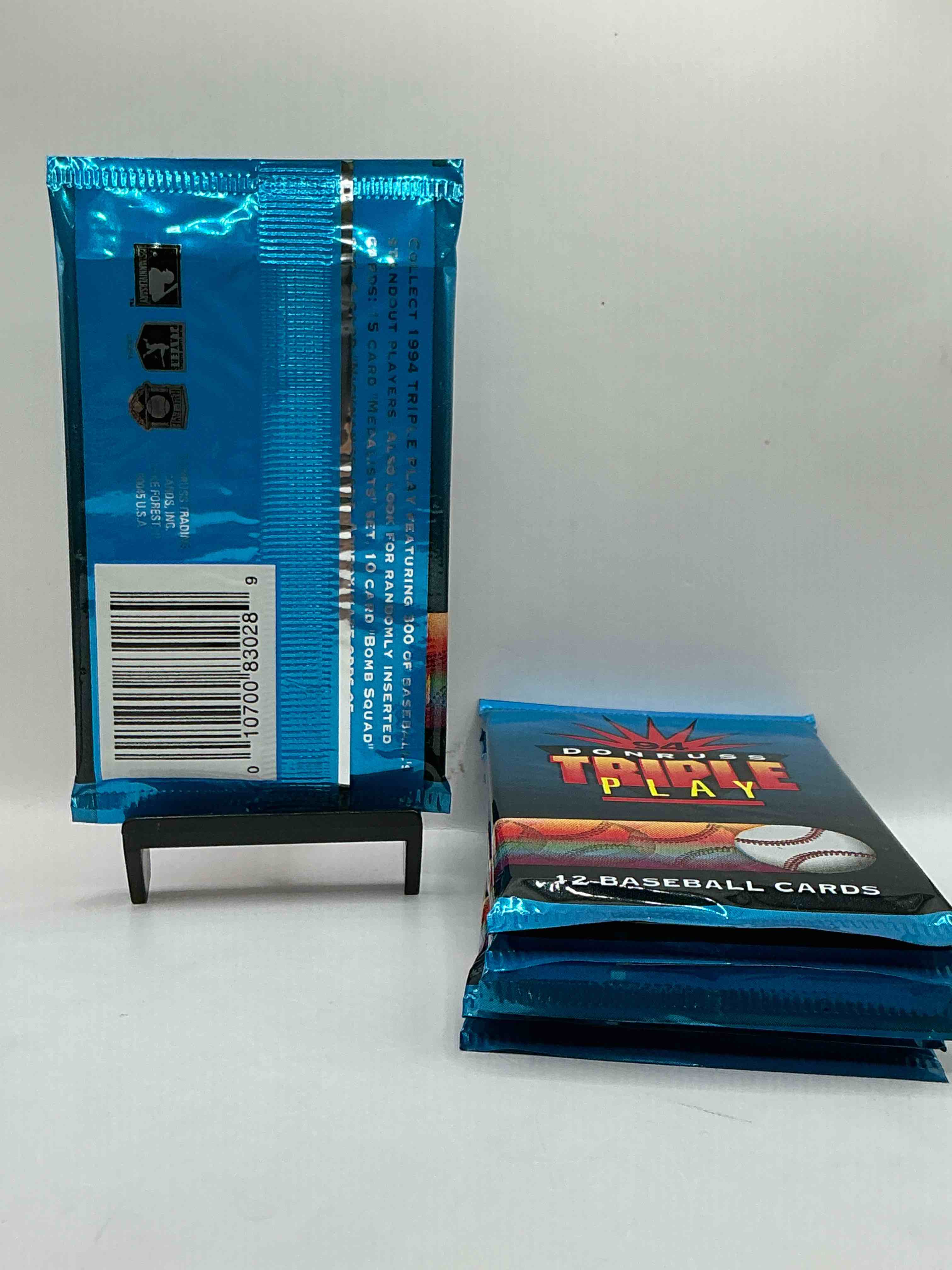 Condition photo showing New/Like New for 1994 donruss triple play mlb baseball 12 card packs! look for 1 ruboff game cards along with griffey jr, mcgwire, ryan & more! rare packs!