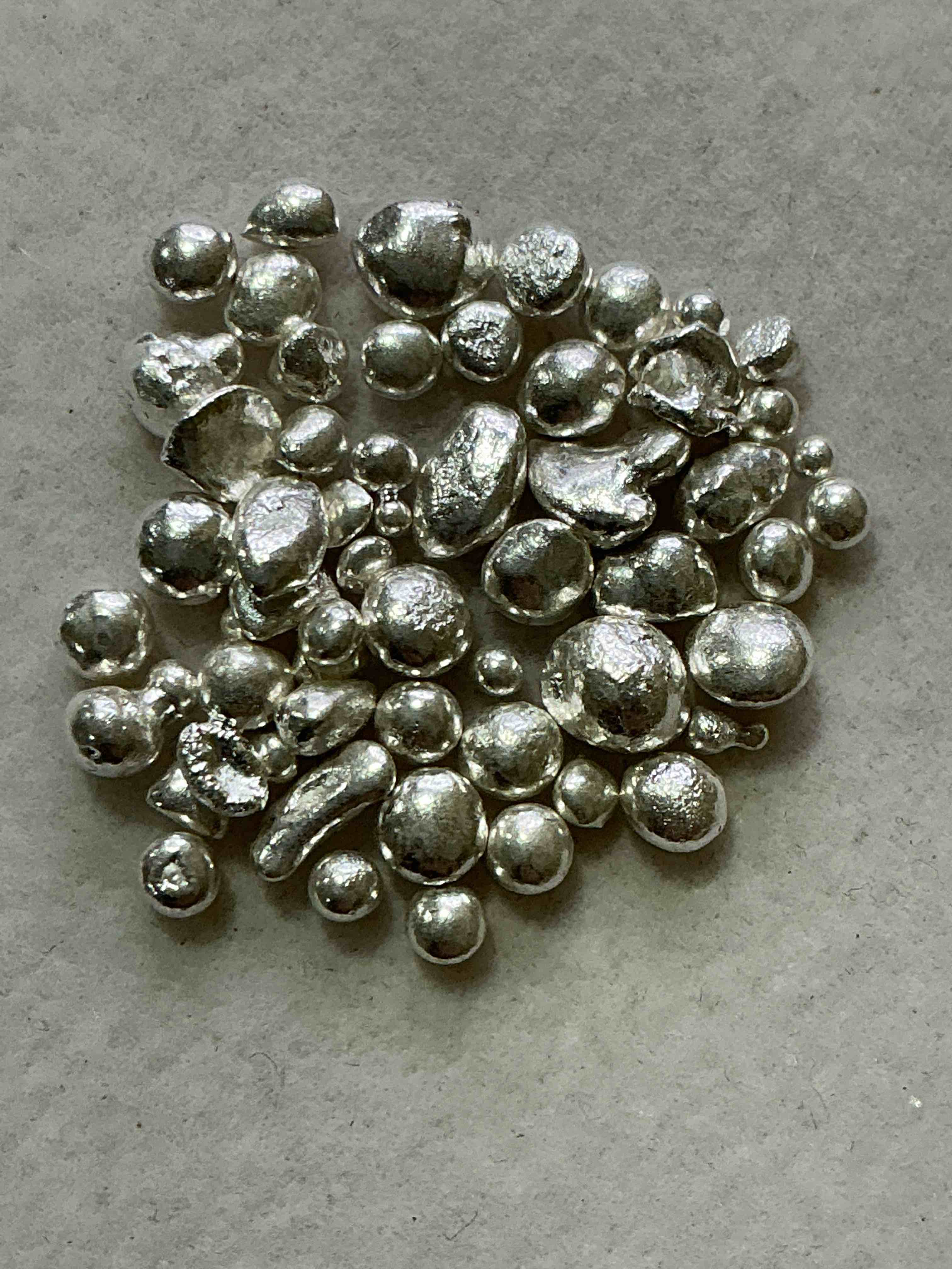 silver nuggets! .999 us fine silver, in small nugget form! total weight of all nuggets in lot approximately 6 grams, bid is per nugget! a cool way to invest in fine us silver! includes collector capsule!