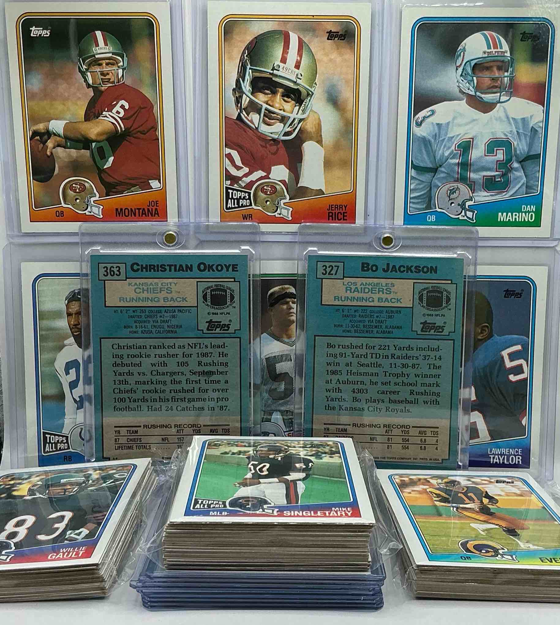 Condition photo showing New/Like New for bo jackson rookie! 1988 topps football cards, 100 card lot! some of the best to ever do it, all in one place! joe montana, jerry rice, bo jackson rookie, lawrence taylor, dan marino & more! along with players like mike singletary, art monk & more! 100 card lot, includes the 50 best players & 50 of their teammates & rivals… all in one place! wow! 