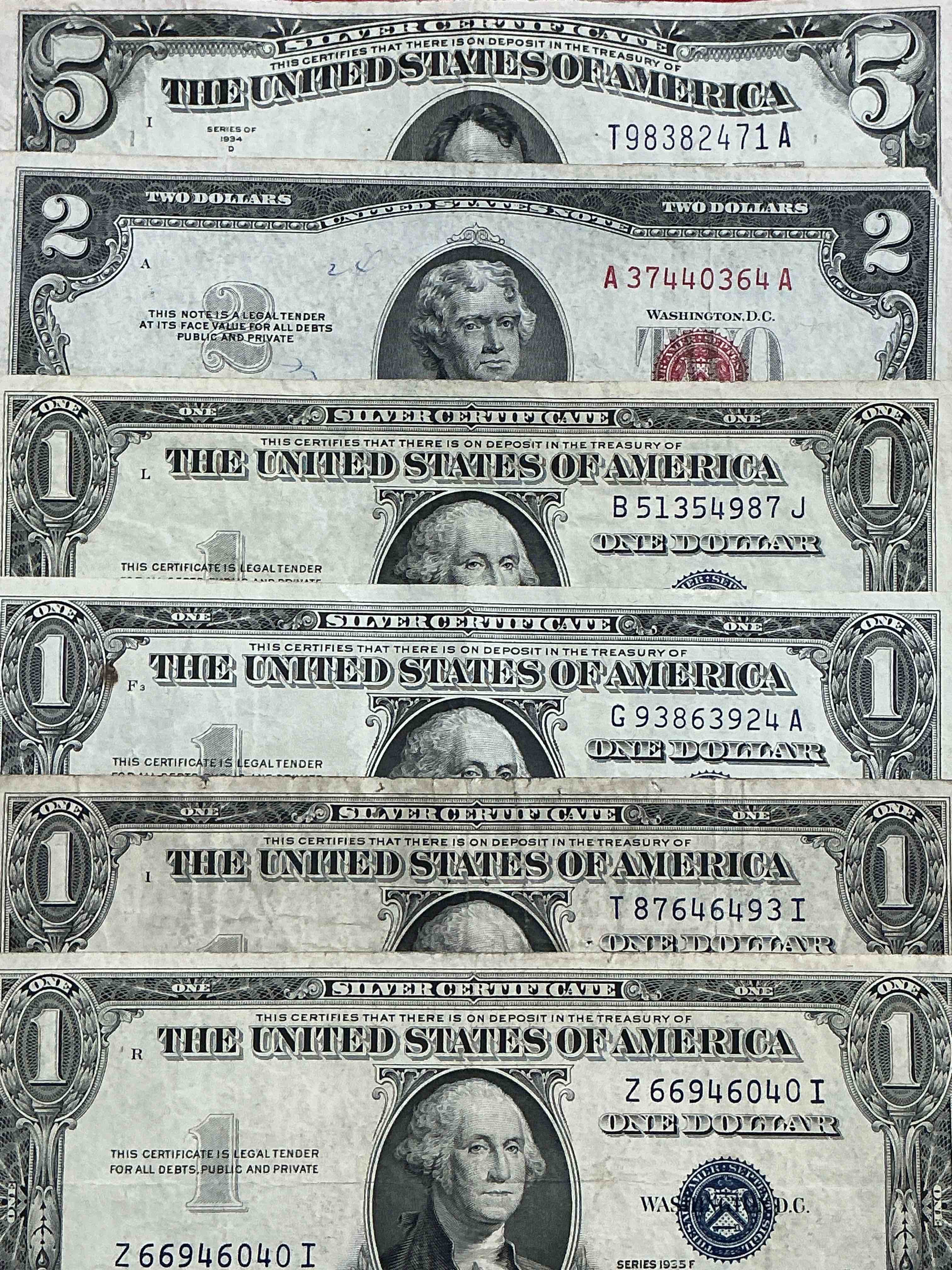 Rare American Dollar Bills! Blue Seal Five Dollar Bill & Red Seal Two Dollar Bill, Along With Silver Certificates! Five Dollar Bill Ultra Rare & In Good Condition, Red Seal Two Dollar Bill In Good Condition & Silver Certificates Produced From 1878 To 1964 & Are Still Considered Legal Tender At Face Value. Here Are Gorgeous, Circulated 1935 & 1957 U.S. One Dollar Silver Certificate, With Highly Collectible "Blue Seal!* Own An Awesome Piece Of History! American Dollar Lot! 