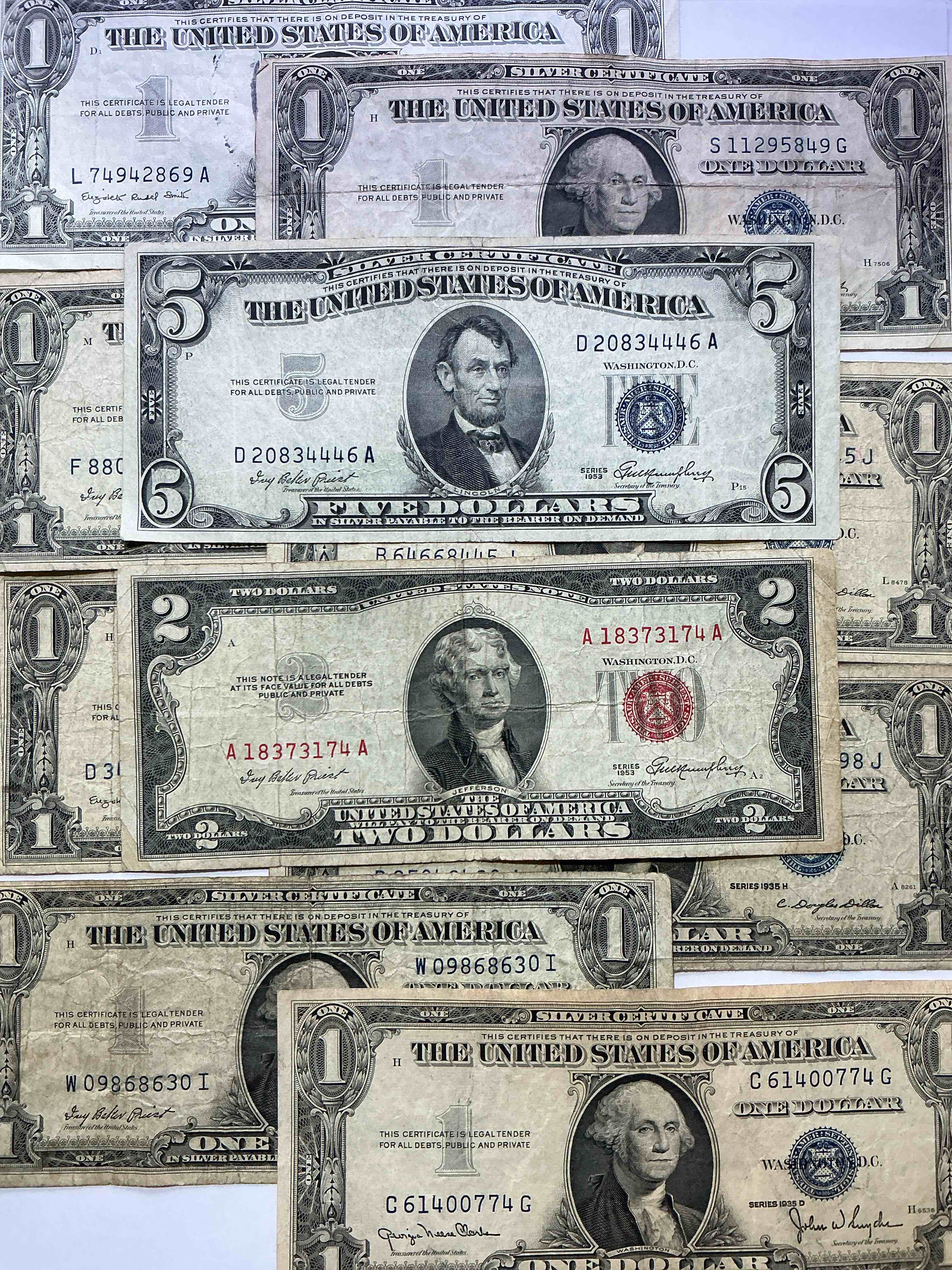 rare american dollar bills! blue seal five dollar bill & red seal two dollar bill, along with silver certificates! five dollar bill ultra rare & in good condition, red seal two dollar bill in good condition & silver certificates produced from 1878 to 1964 & are still considered legal tender at face value. here are gorgeous, circulated 1935 & 1957 u.s. one dollar silver certificate, with highly collectible "blue seal!* own an awesome piece of history! american dollar lot! 