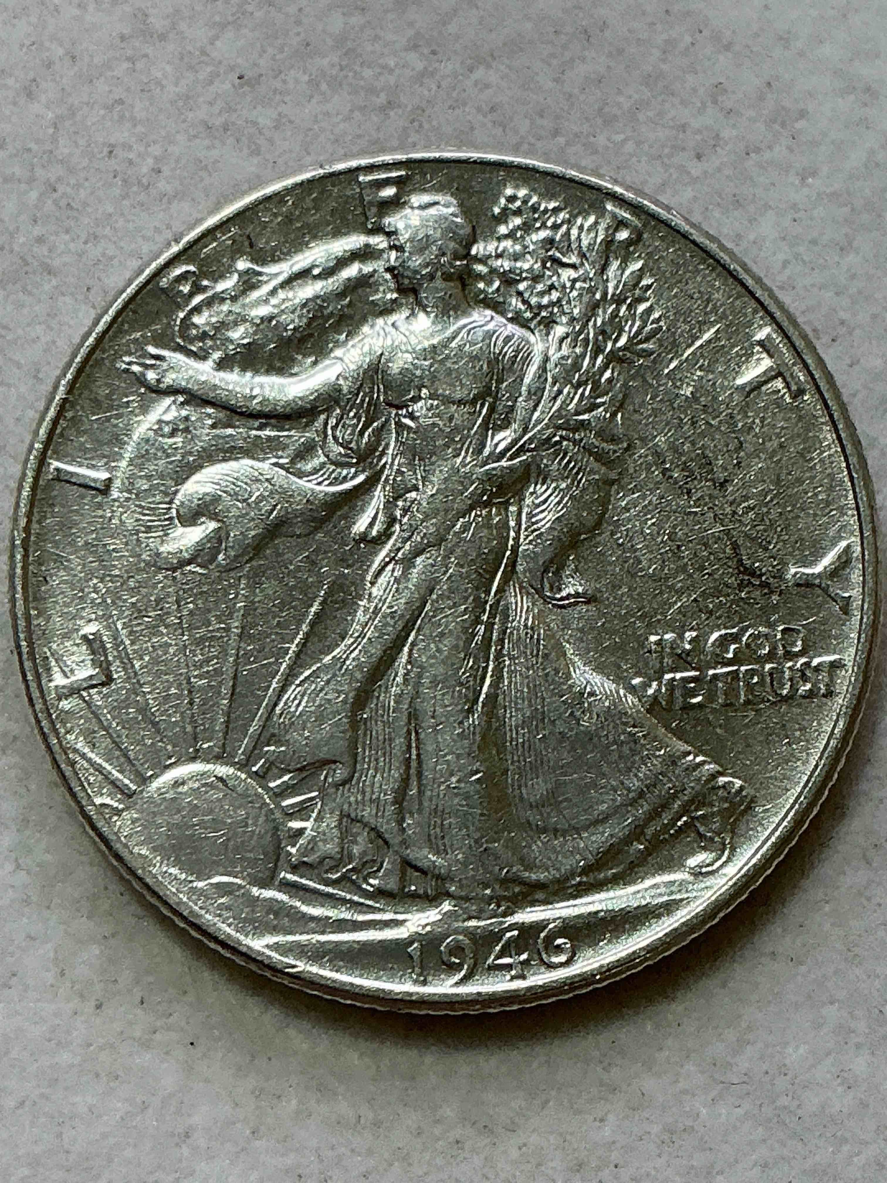 world war ii era silver! antique u.s. silver! liberty walking silver fine u.s. silver half dollar! this striking half dollars were minted from 1916-1947 & have become some of the most collectible coins in history! here is a striking appears uncirculated example from 1946! liberty walking coins are 90% fine u.s. silver, a great investment in precious metal!