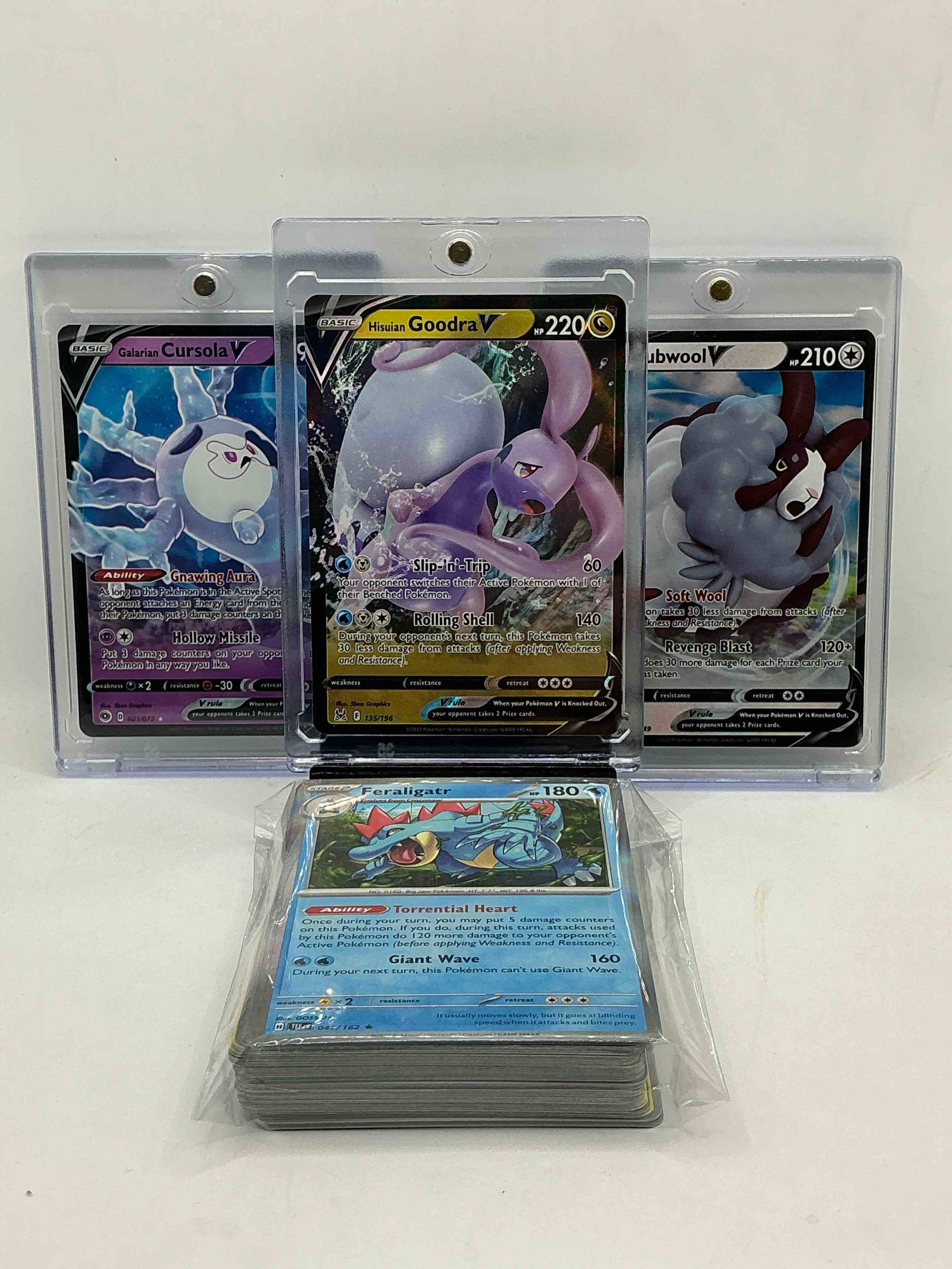 Pokémon Palooza! Hisuian Goodra V! Galarian Cursola V! Dubwool V! Along With 50 Other Pokémon Heroes, Holos, Legends & Commons- Including Holographic Cards, Stage 2 Cards, Holos In All Forms & More! Also Includes 36 Non Holo Common/ Uncommon Basic & First Stage Cards Trainers & Energy Too! Perfect Set For Collectors & Enthusiasts!