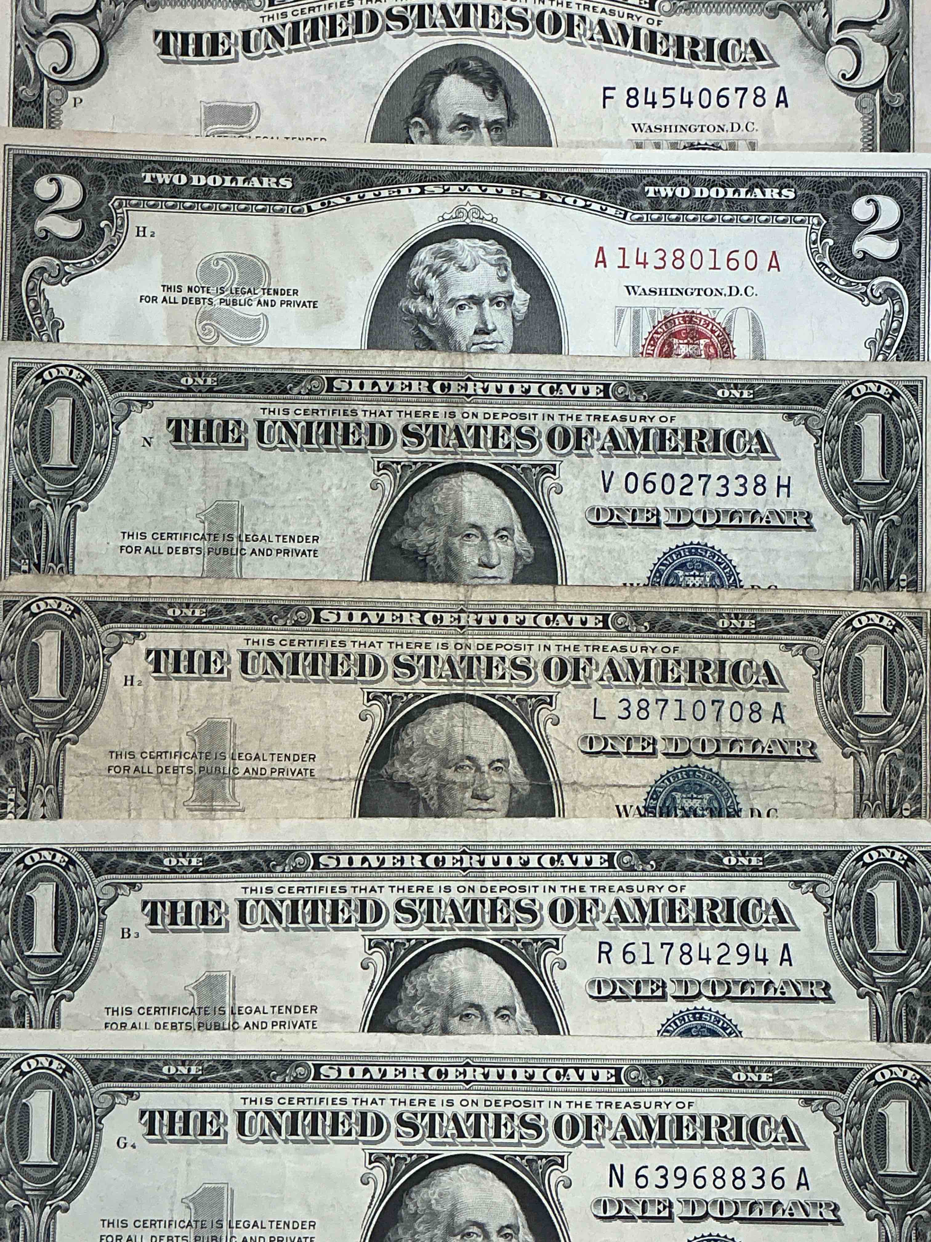 Rare American Dollar Bills! Blue Seal Five Dollar Bill & Red Seal Two Dollar Bill, Along With Silver Certificates! Five Dollar Bill Ultra Rare & In Good Condition, Red Seal Two Dollar Bill In Good Condition & Silver Certificates Produced From 1878 To 1964 & Are Still Considered Legal Tender At Face Value. Here Are Gorgeous, Circulated 1935 & 1957 U.S. One Dollar Silver Certificate, With Highly Collectible "Blue Seal!* Own An Awesome Piece Of History! American Dollar Lot! 