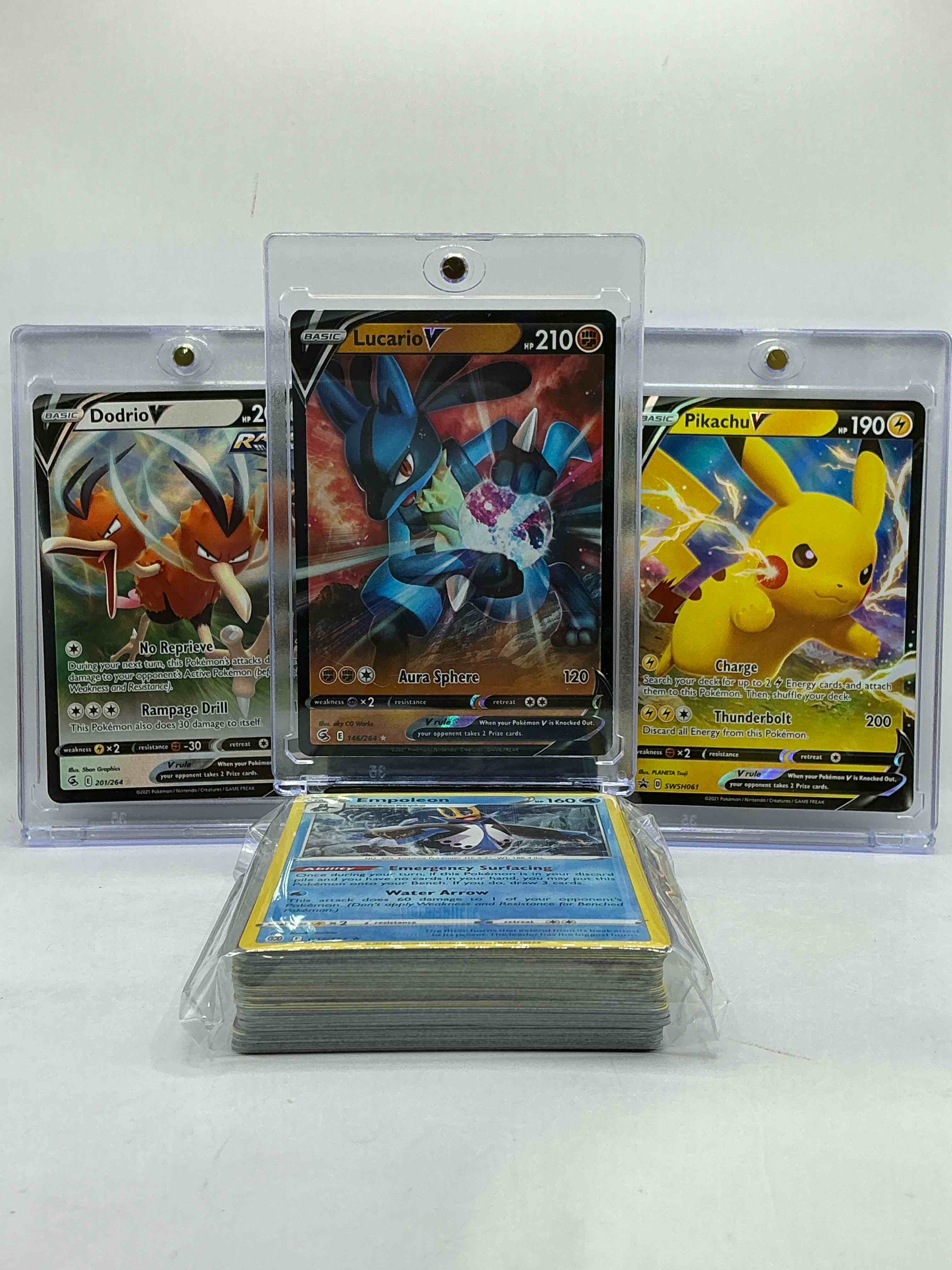 Lucario V, Pikachu V & More! Matching V Trio! Insane Pokémon Card Lot! Along With 50 Other Pokémon Heroes, Holos, Legends & Commons- Including Holographic Cards, Stage 2 Cards, Holos In All Forms & More! Also Includes 36 Non Holo Common/ Uncommon Basic & First Stage Cards Trainers & Energy Too! Perfect Set For Collectors & Enthusiasts!