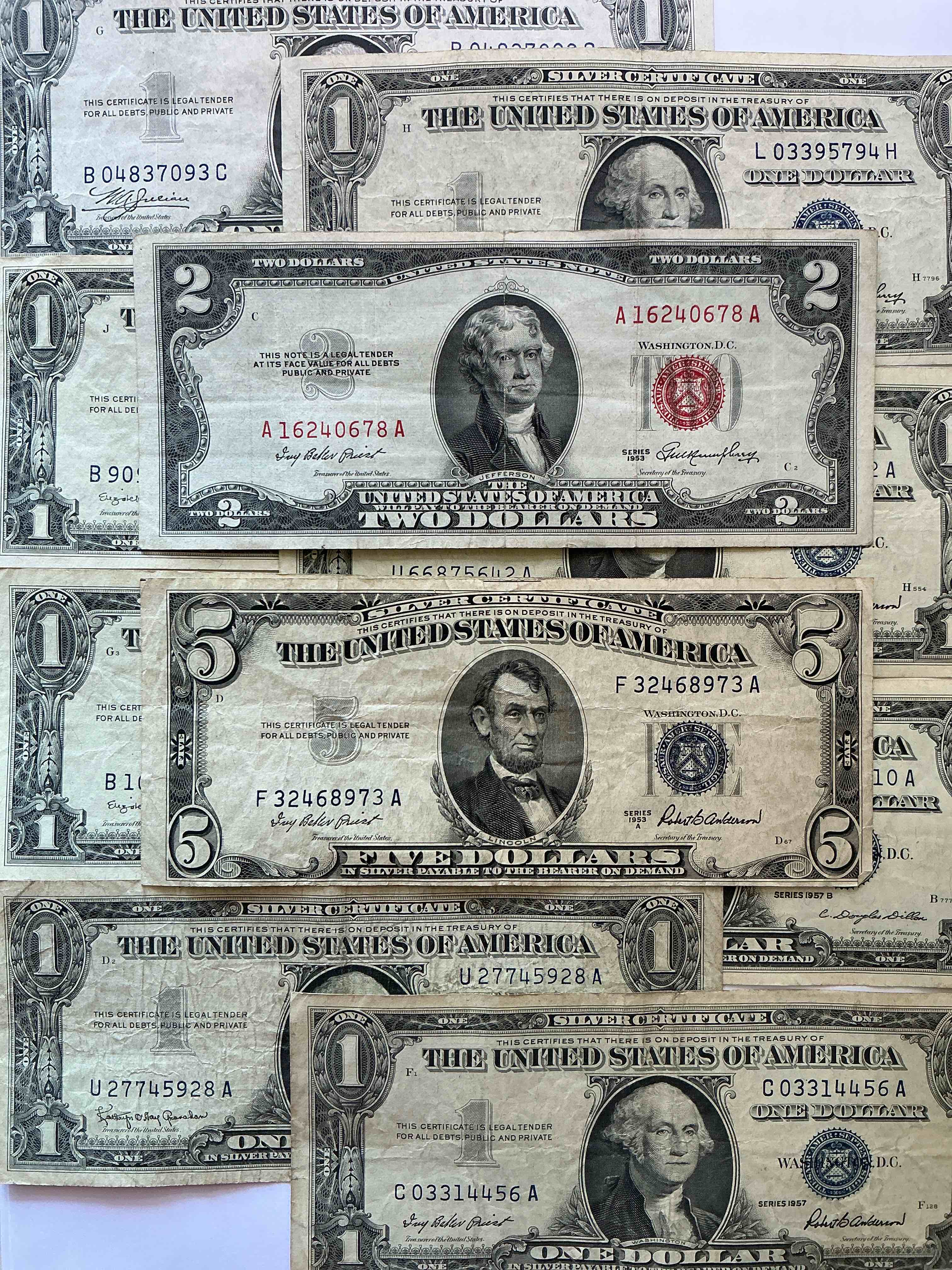 rare american dollar bills! blue seal five dollar bill & red seal two dollar bill, along with silver certificates! five dollar bill ultra rare & in good condition, red seal two dollar bill in good condition & silver certificates produced from 1878 to 1964 & are still considered legal tender at face value. here are gorgeous, circulated 1935 & 1957 u.s. one dollar silver certificate, with highly collectible "blue seal!* own an awesome piece of history! american dollar lot! 