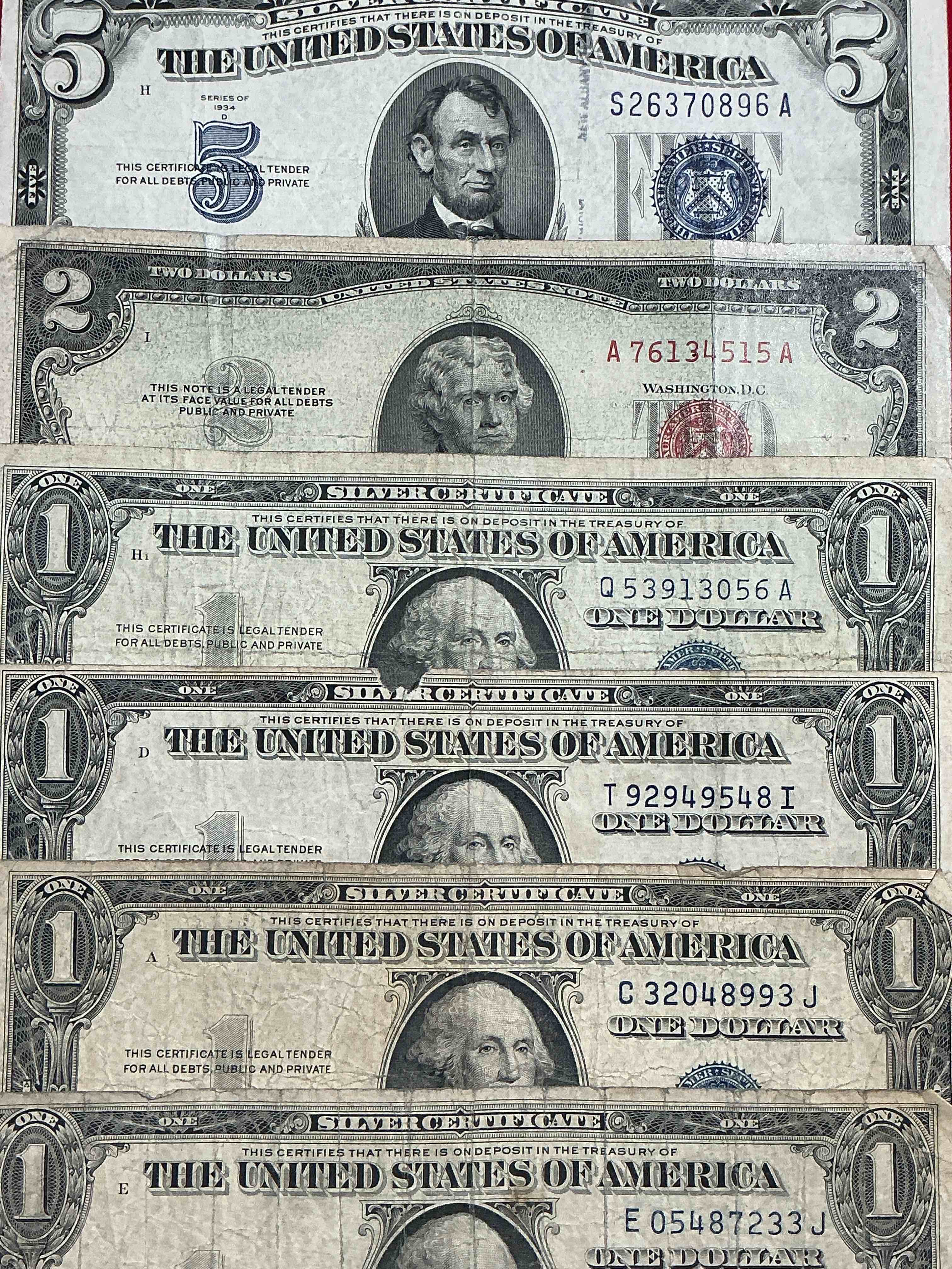 rare american dollar bills! blue seal five dollar bill & red seal two dollar bill, along with silver certificates! five dollar bill ultra rare & in good condition, red seal two dollar bill in good condition & silver certificates produced from 1878 to 1964 & are still considered legal tender at face value. here are gorgeous, circulated 1935 & 1957 u.s. one dollar silver certificate, with highly collectible "blue seal!* own an awesome piece of history! american dollar lot! 