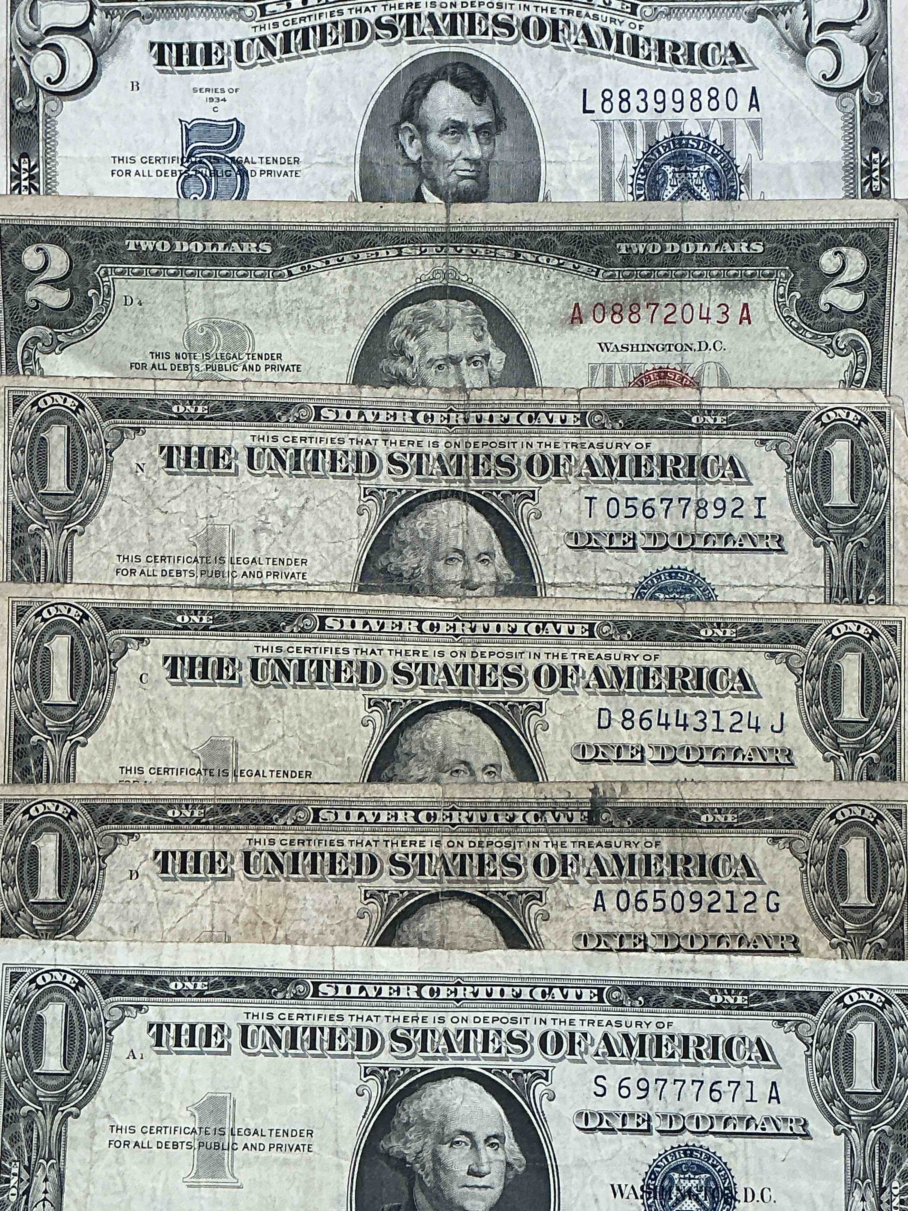 rare american dollar bills! blue seal five dollar bill & red seal two dollar bill, along with silver certificates! five dollar bill ultra rare & in good condition, red seal two dollar bill in good condition & silver certificates produced from 1878 to 1964 & are still considered legal tender at face value. here are gorgeous, circulated 1935 & 1957 u.s. one dollar silver certificate, with highly collectible "blue seal!* own an awesome piece of history! american dollar lot! 