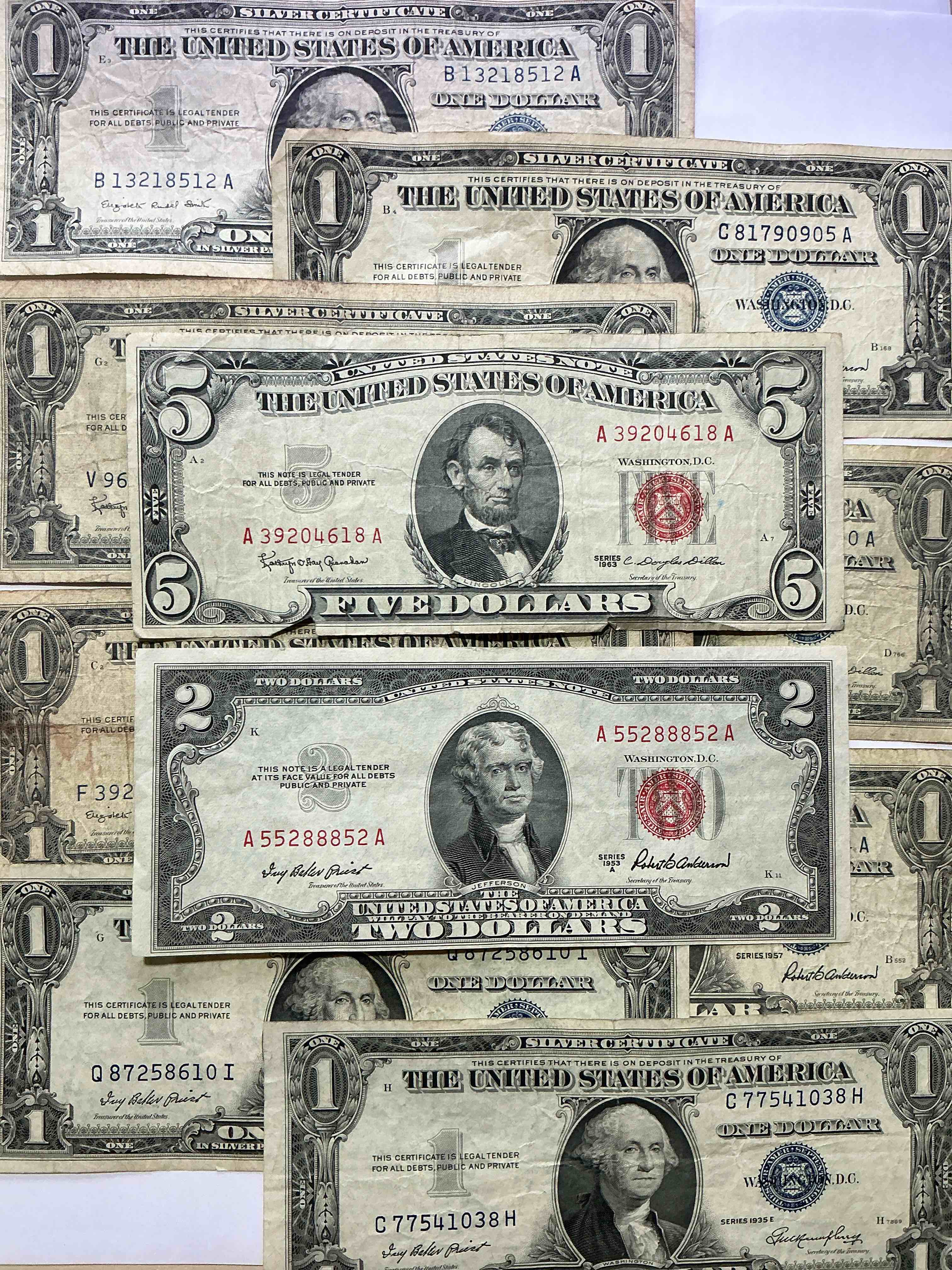 rare american dollar bills! red seal five dollar bill & red seal two dollar bill, along with silver certificates! five dollar bill ultra rare & in good condition, red seal two dollar bill in good condition & silver certificates produced from 1878 to 1964 & are still considered legal tender at face value. here are gorgeous, circulated 1935 & 1957 u.s. one dollar silver certificate, with highly collectible "blue seal!* own an awesome piece of history! american dollar lot! 