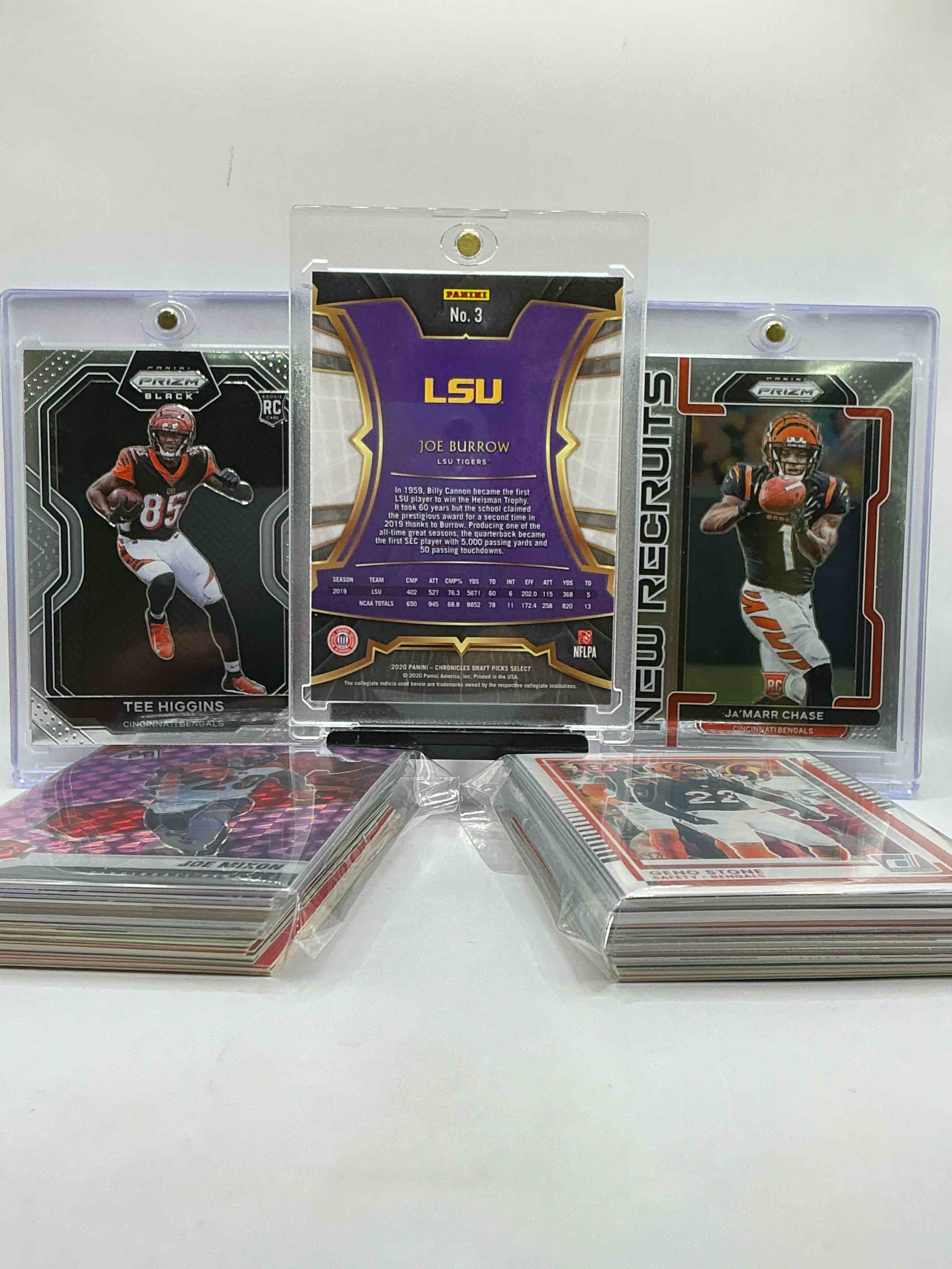 Condition photo showing New/Like New for joe burrow select rookie, tee higgins prizm black rookie & ja’marr chase prizm rookie! insane trio! bengal bonanza! filled with legends, heroes, vintage & new!