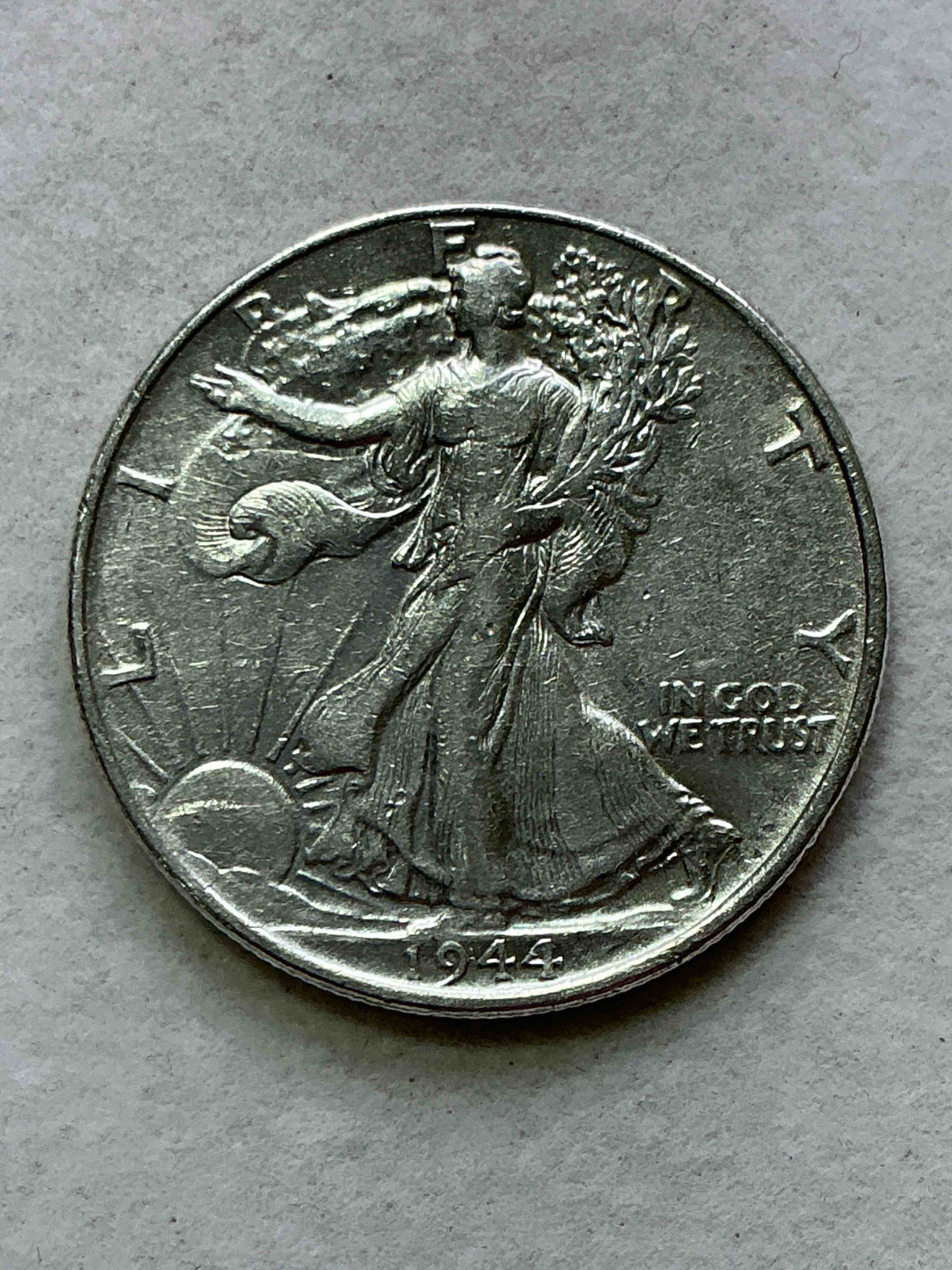 world war ii era silver! antique u.s. silver! liberty walking silver fine u.s. silver half dollar! this striking half dollars were minted from 1916-1947 & have become some of the most collectible coins in history! here is a striking appears uncirculated example from 1944! liberty walking coins are 90% fine u.s. silver, a great investment in precious metal!