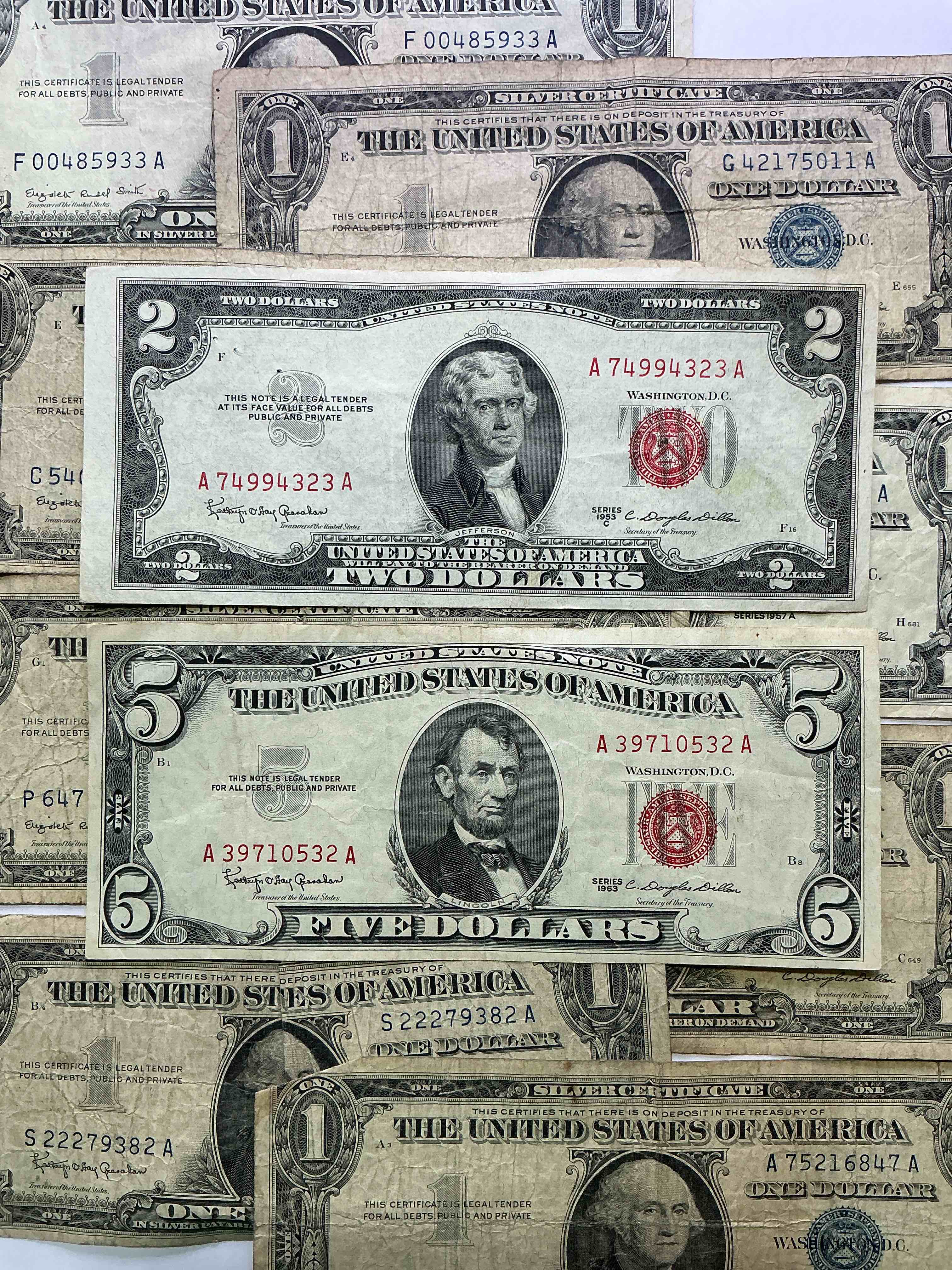 rare american dollar bills! red seal five dollar bill & red seal two dollar bill, along with silver certificates! five dollar bill ultra rare & in good condition, red seal two dollar bill in good condition & silver certificates produced from 1878 to 1964 & are still considered legal tender at face value. here are gorgeous, circulated 1935 & 1957 u.s. one dollar silver certificate, with highly collectible "blue seal!* own an awesome piece of history! american dollar lot! 